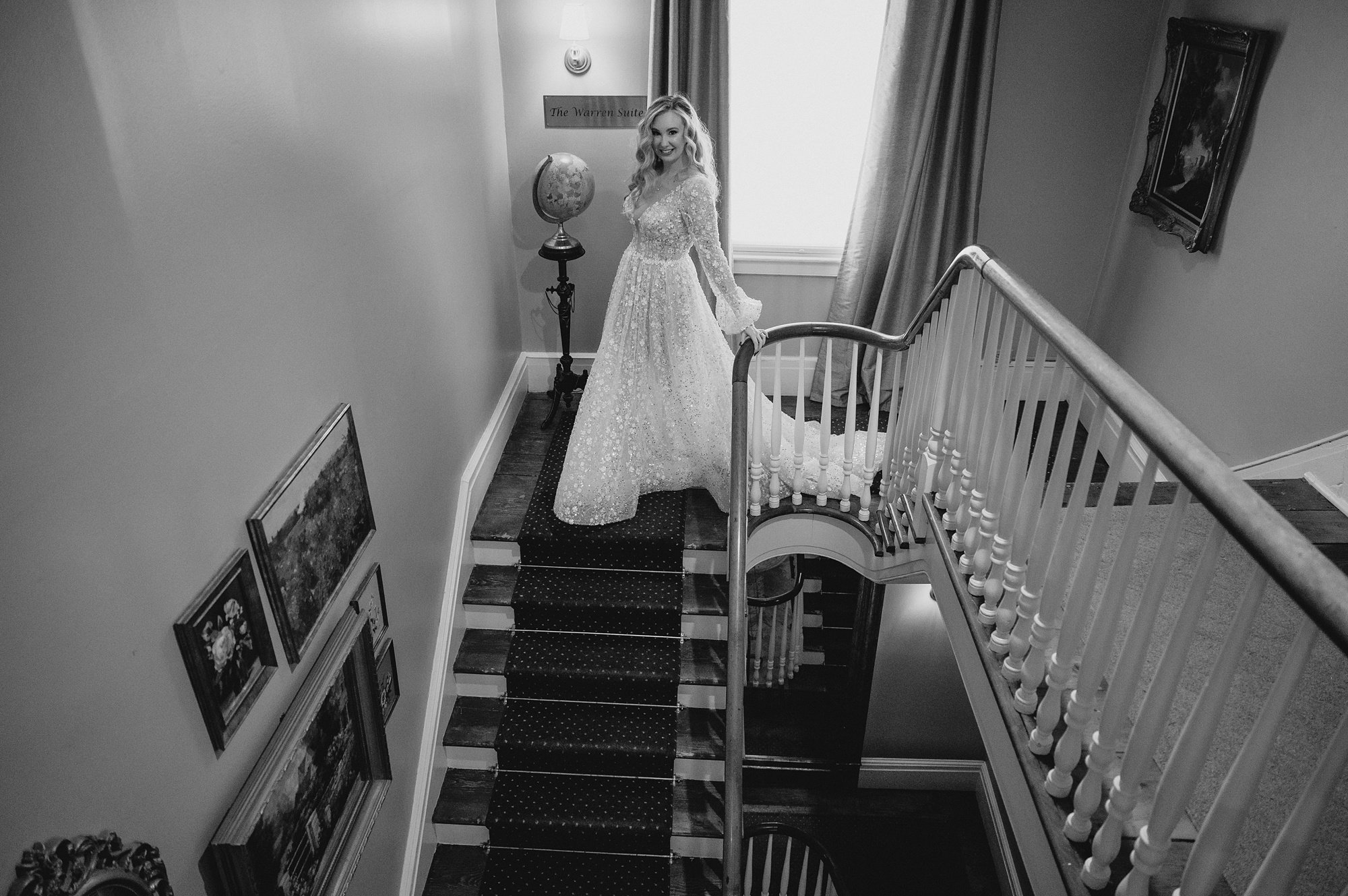 bride turns to walk up stairs inside David's Country Inn