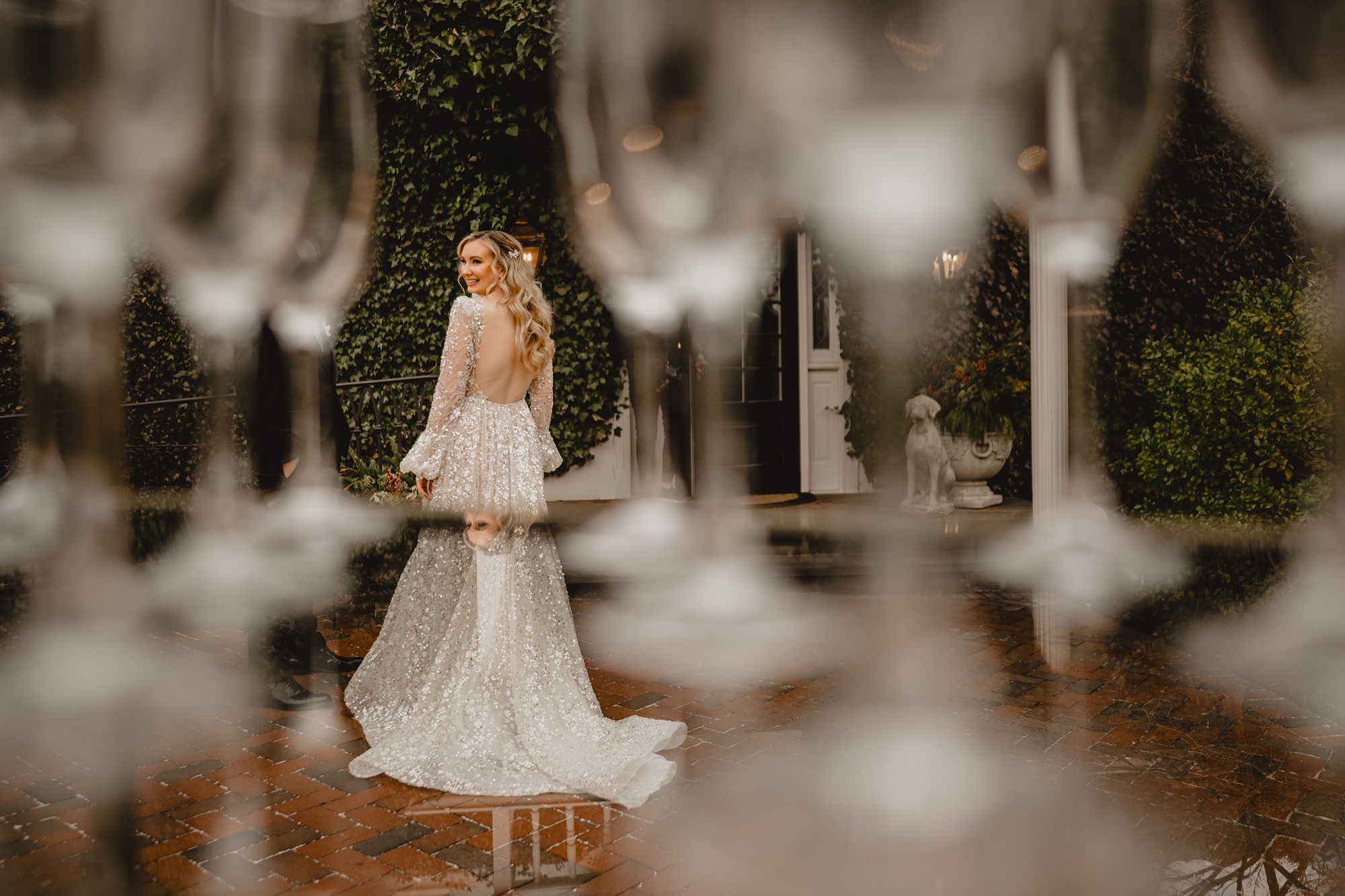 photo of bride taken through glass crystals of chandelier