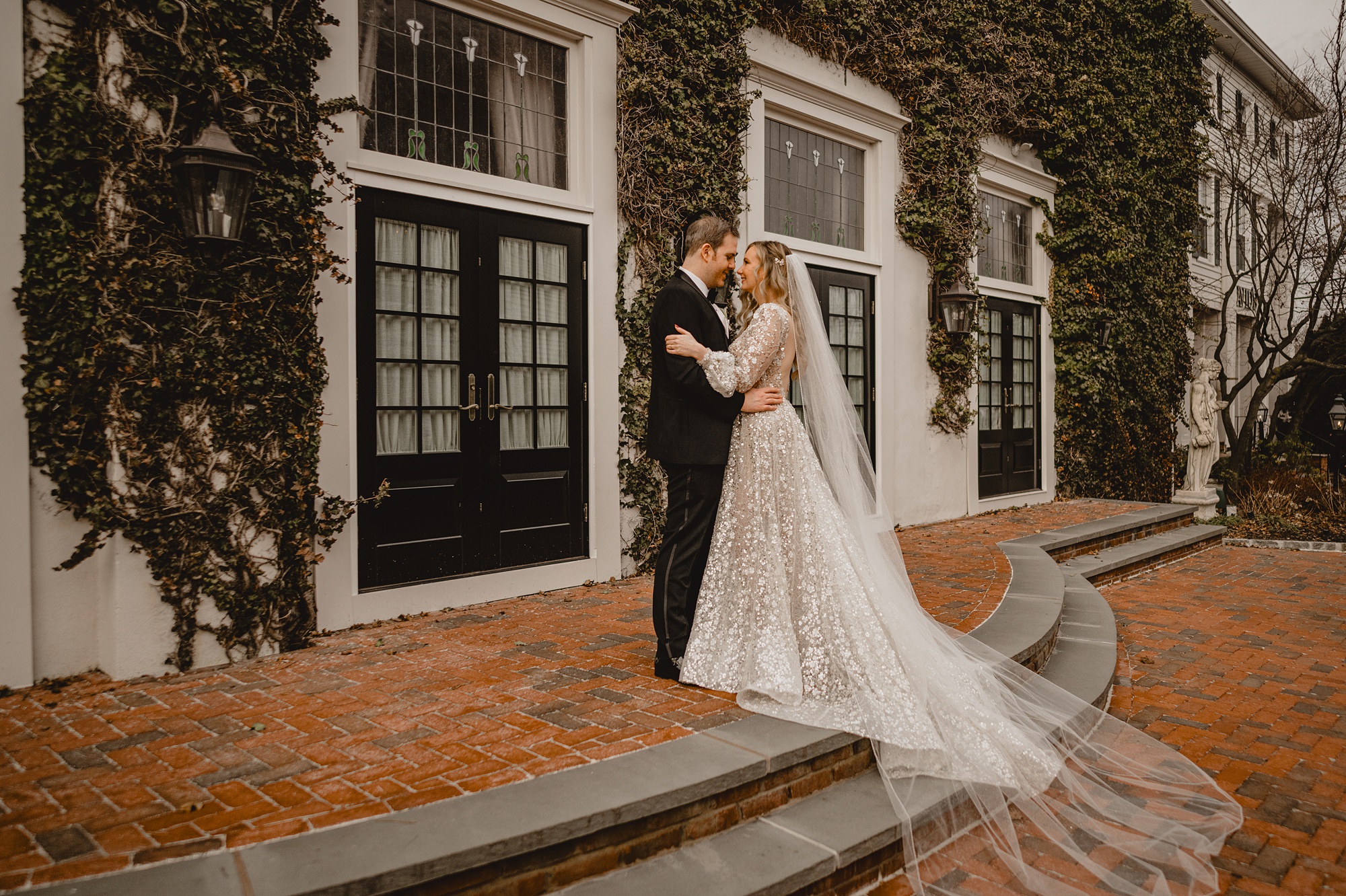 newlyweds hug leaning heads together outside David's Country Inn