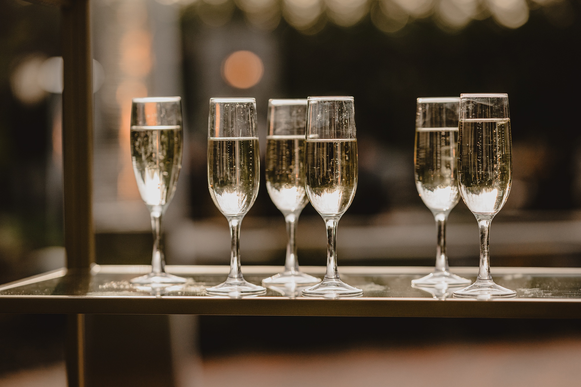 glass of champagne for winter wedding ceremony outside at David's Country Inn