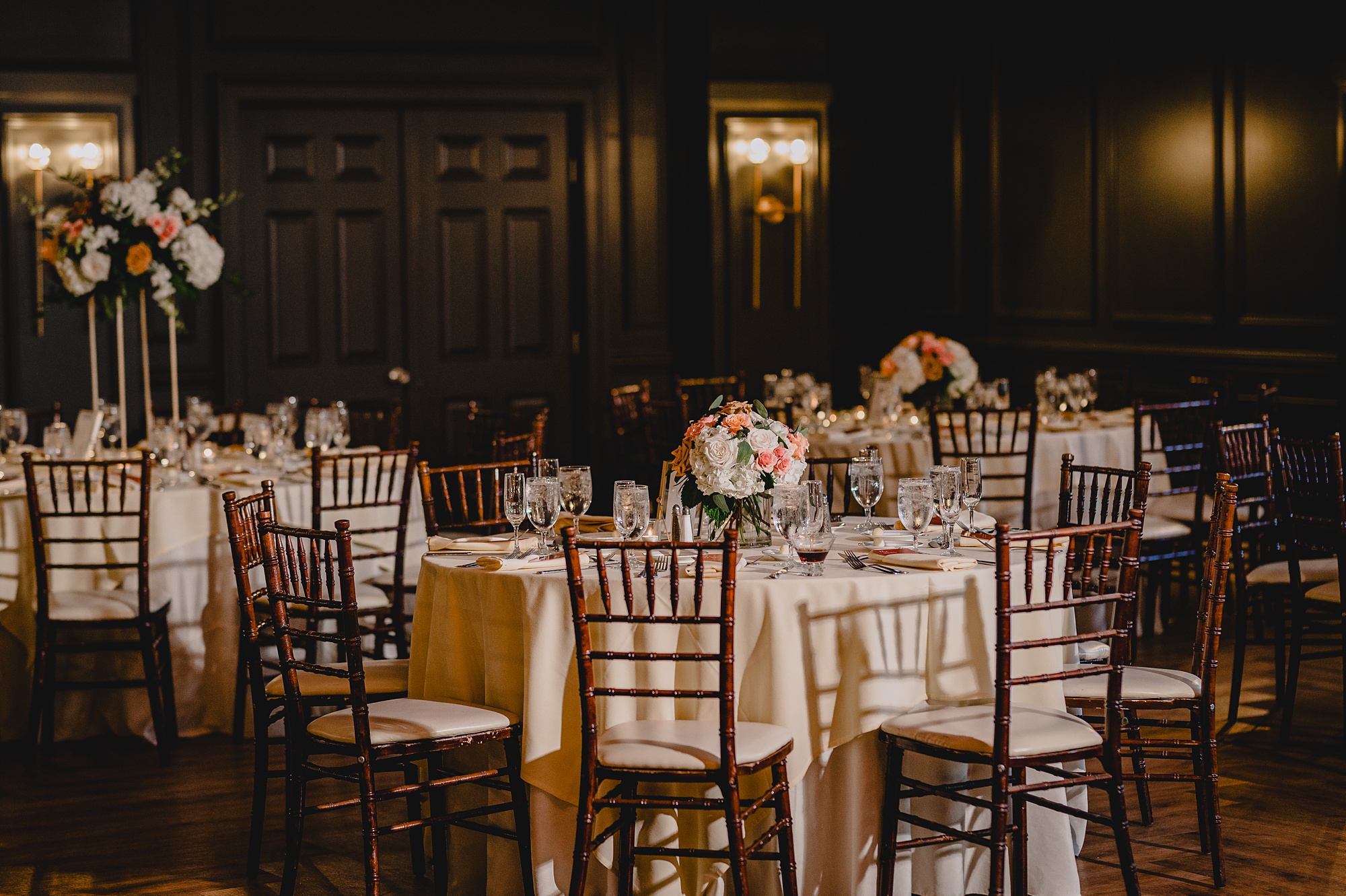 reception table with pink and white flowers at David's Country Inn