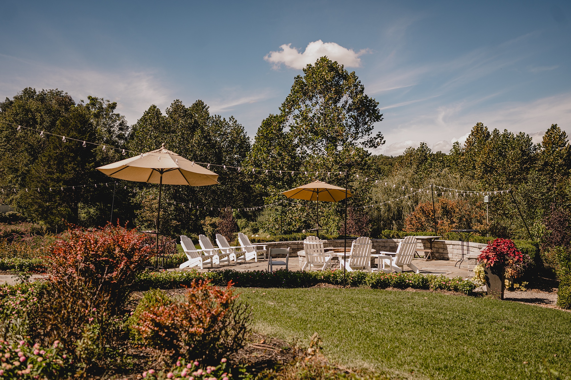 lounger chairs under umbrellas on lawn at Crossed Keys Estate