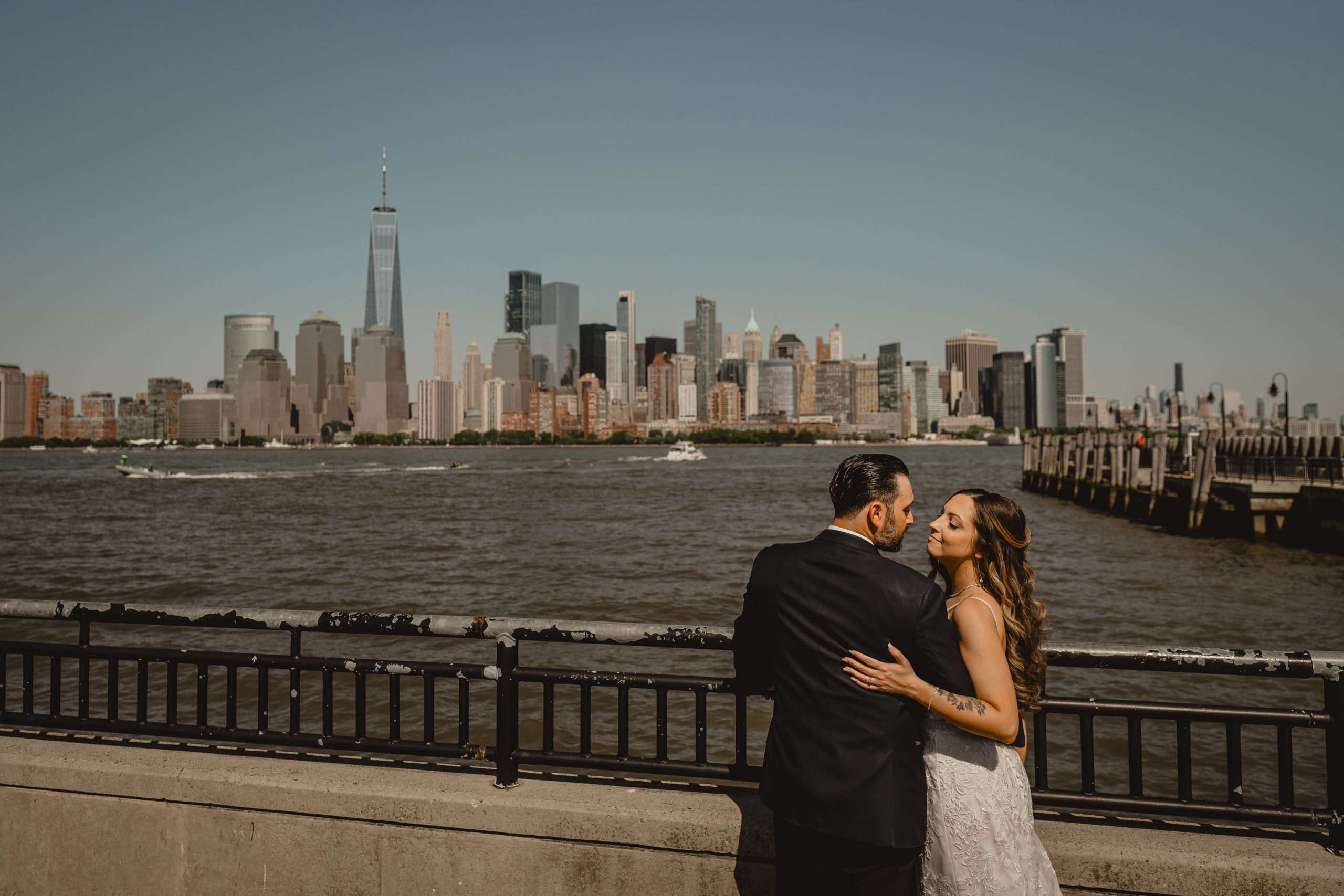 Couple by the lake before their wedding at Maritime Parc.