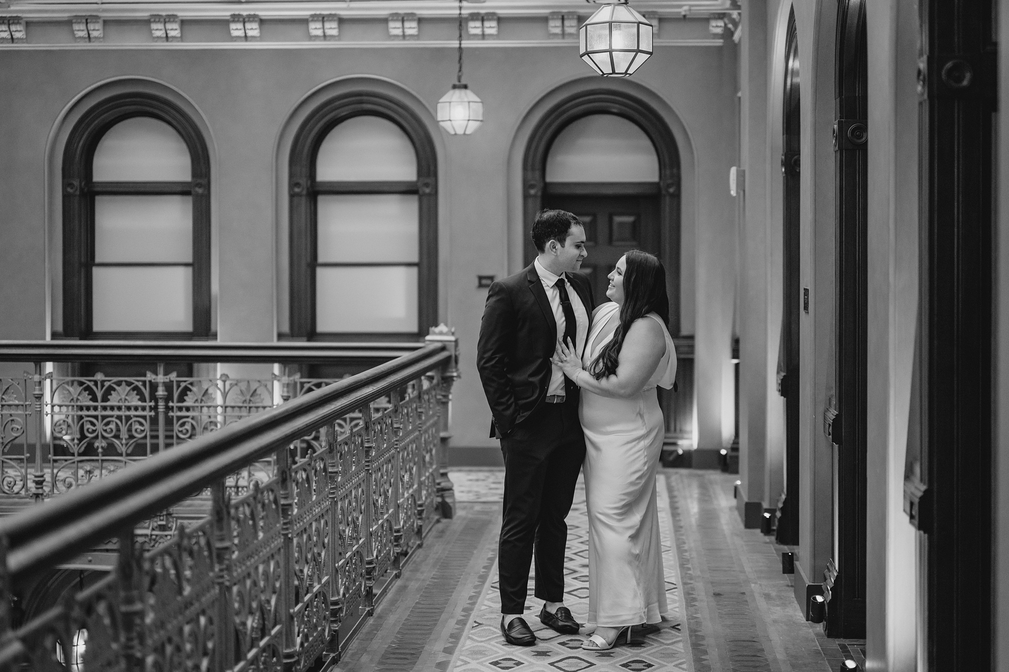 man and woman hug inside the Beekman Hotel