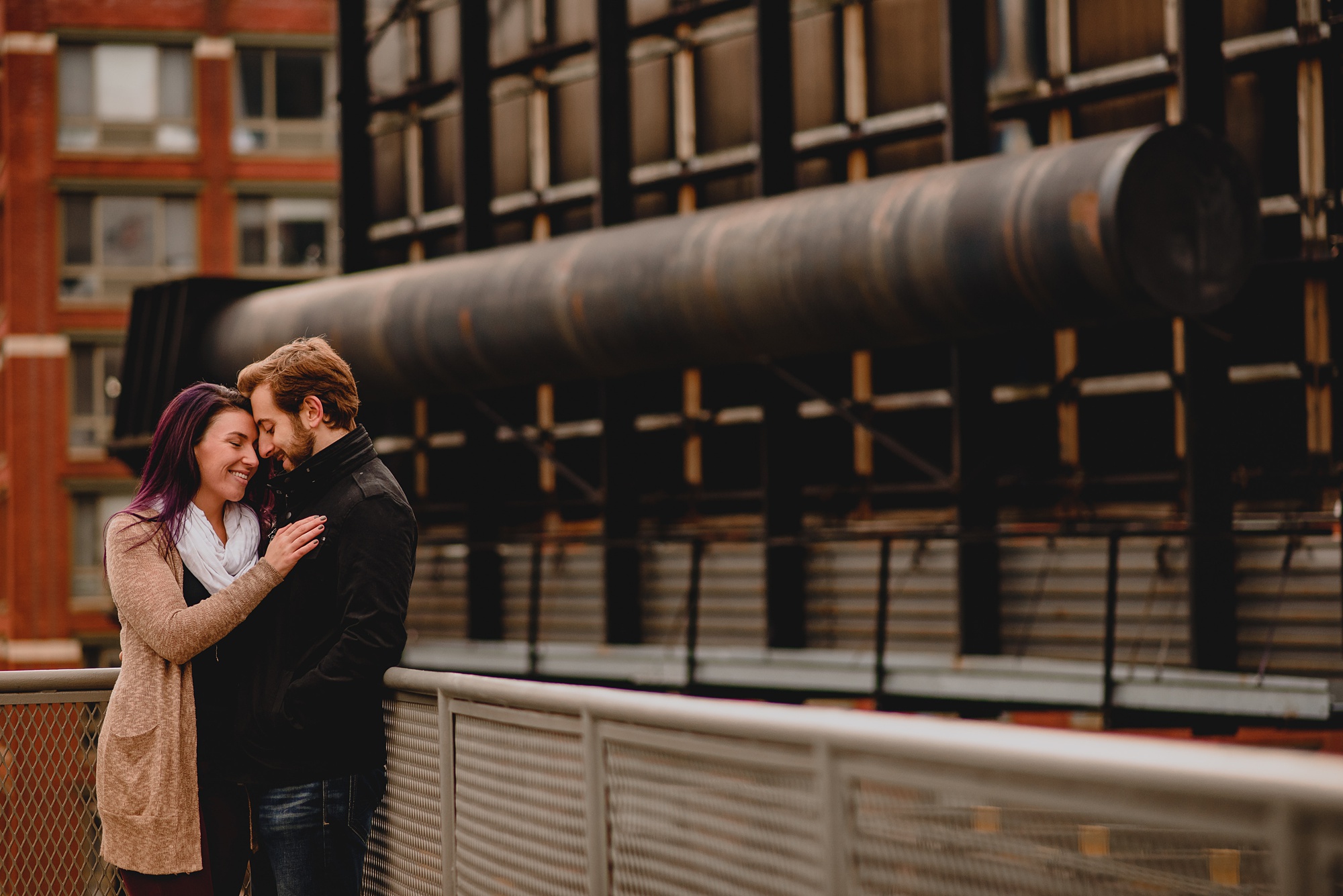 man and woman hug in front of the High Line