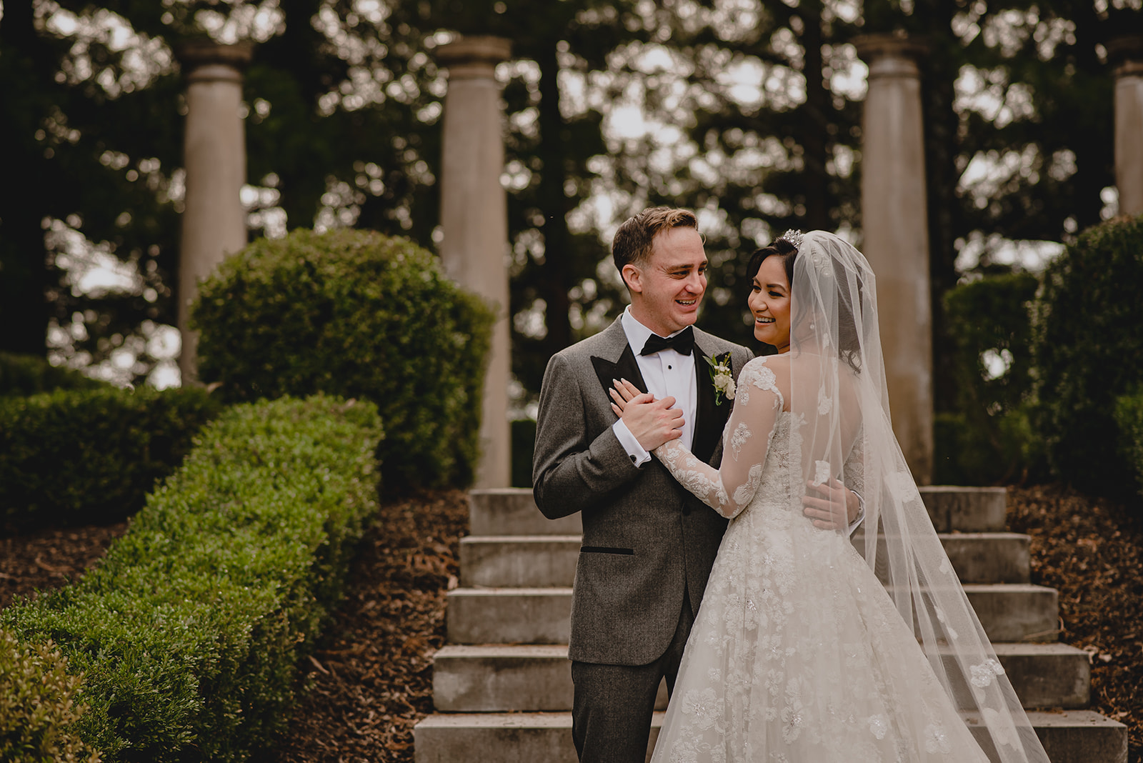 bride and groom dance in gardens of Ashford Estate