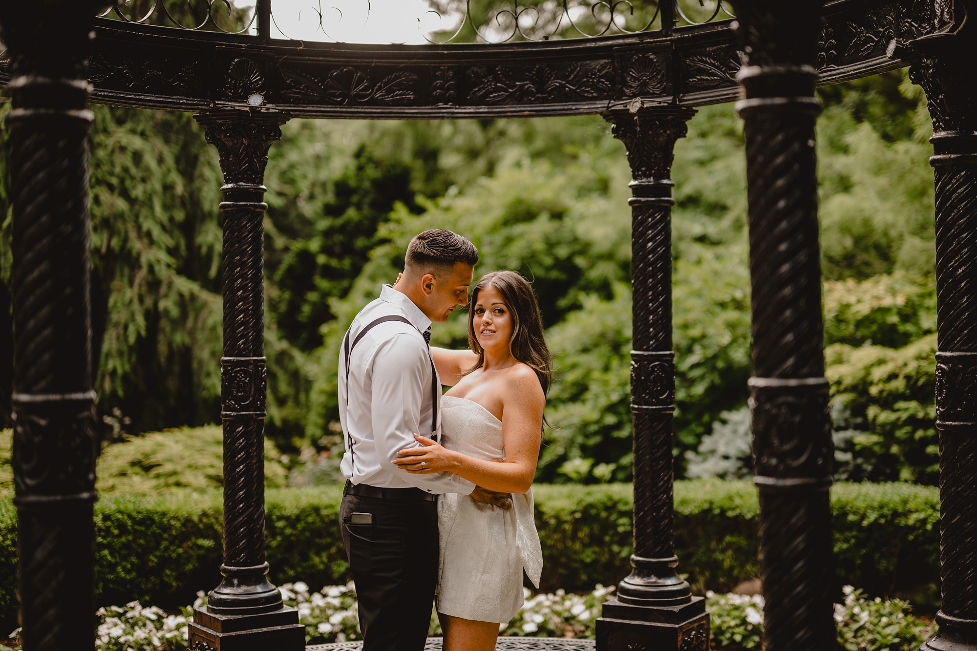man and woman hug in black gazebo at the Ashford Estate