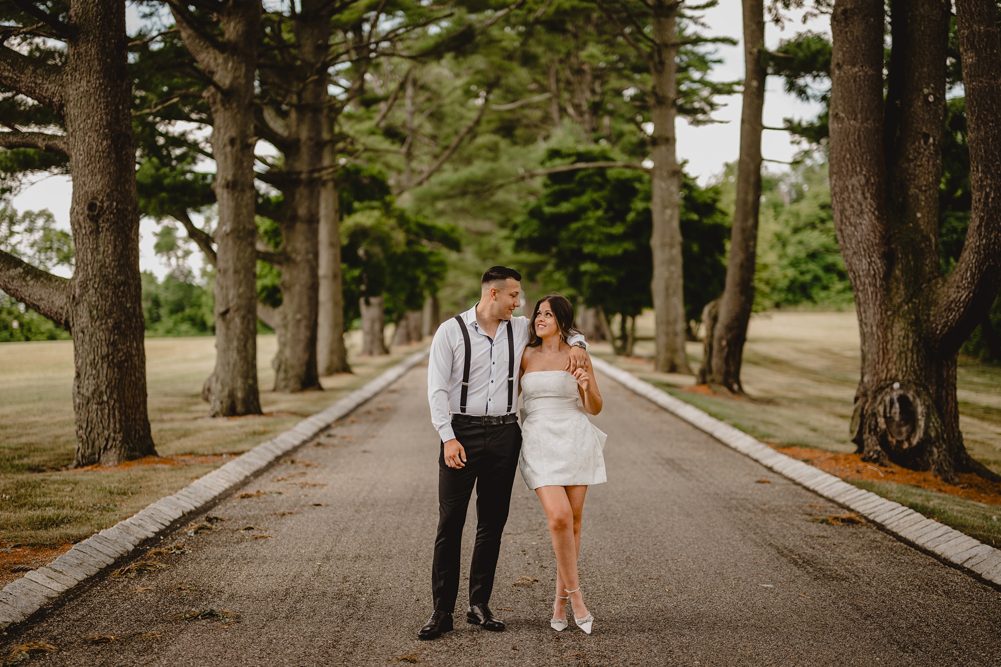 engaged couple hugs on the driveway at the Ashford Estate