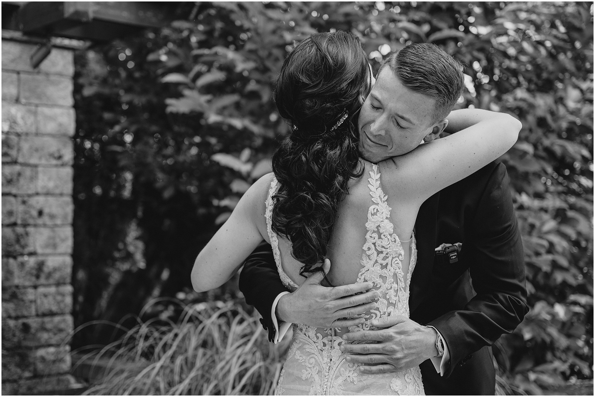 groom hugs bride during first look for New Jersey wedding day at the Conservatory