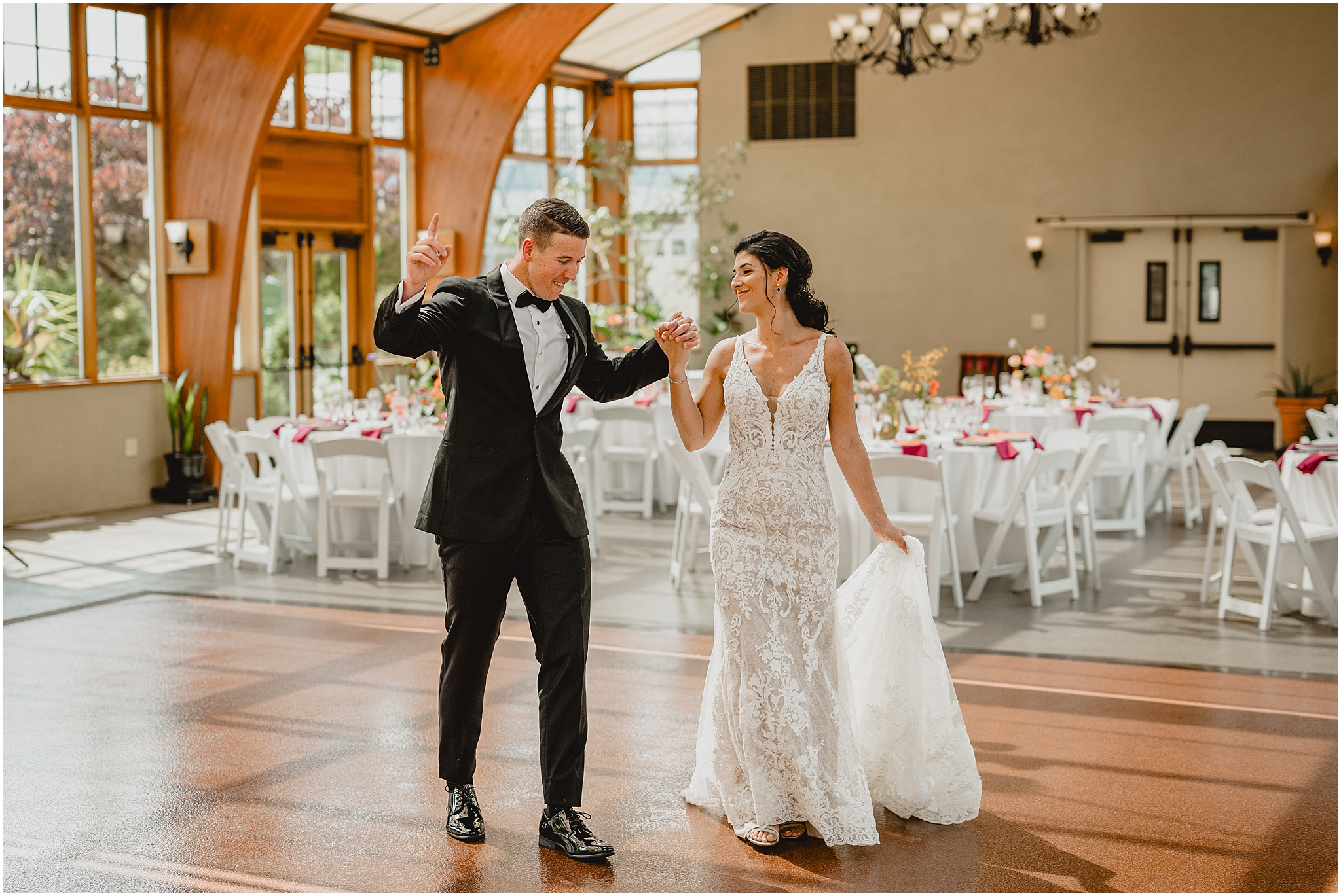 newlyweds dance on floor in ballroom at the Conservatory at Sussex County Fairgrounds