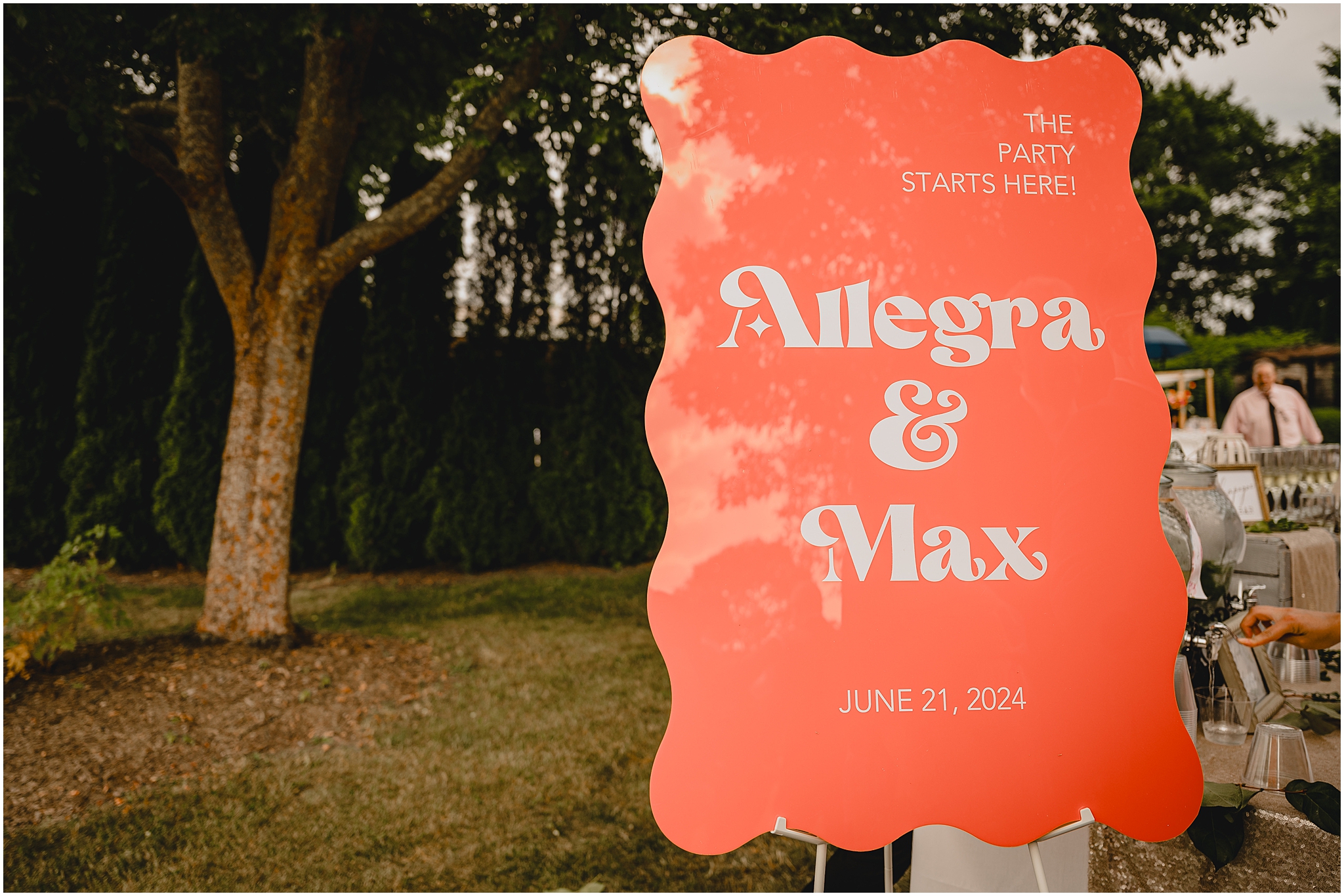coral welcome sign for ceremony outside the Conservatory at Sussex County Fairgrounds