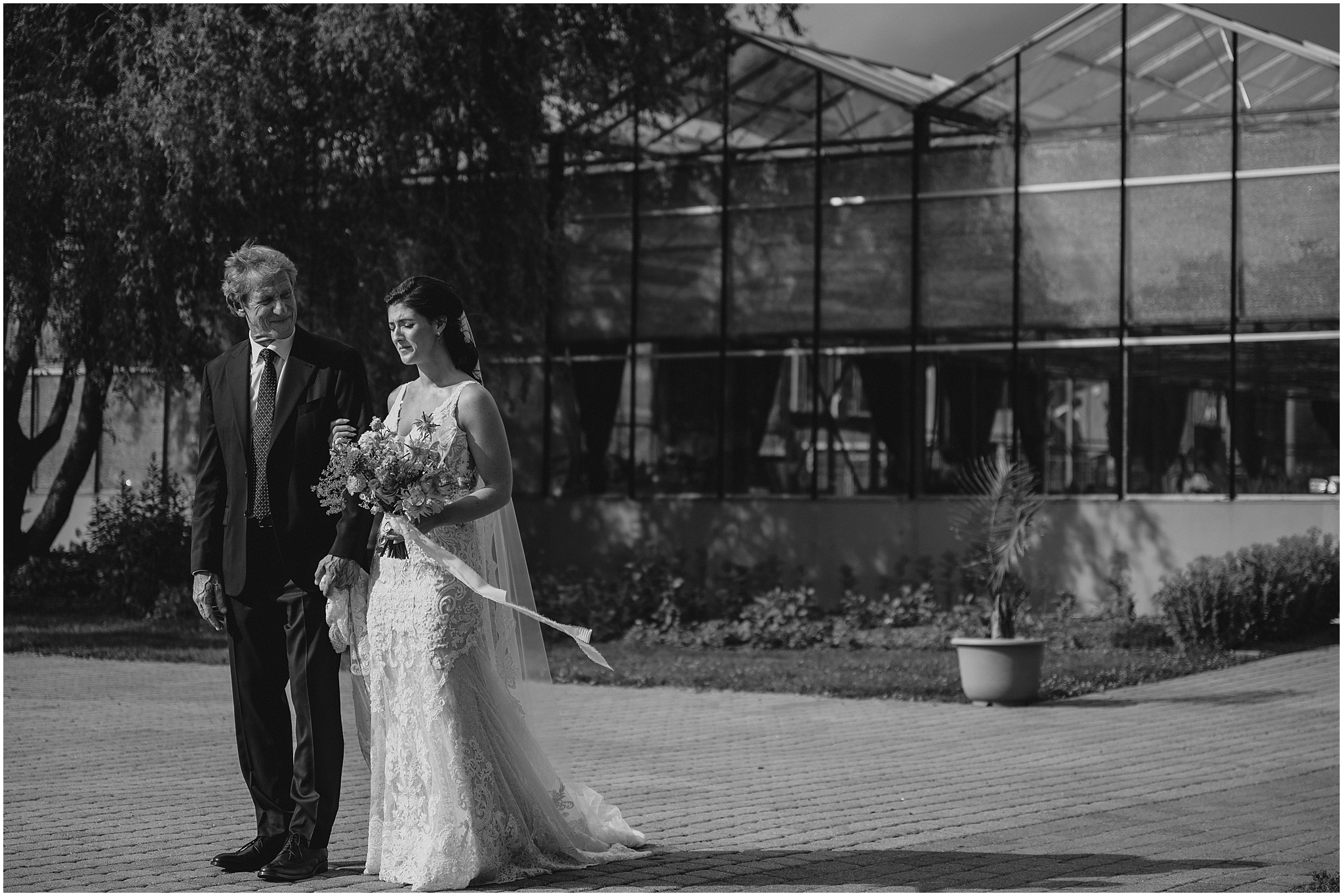 bride and father stand talking outside the Conservatory at Sussex County Fairgrounds