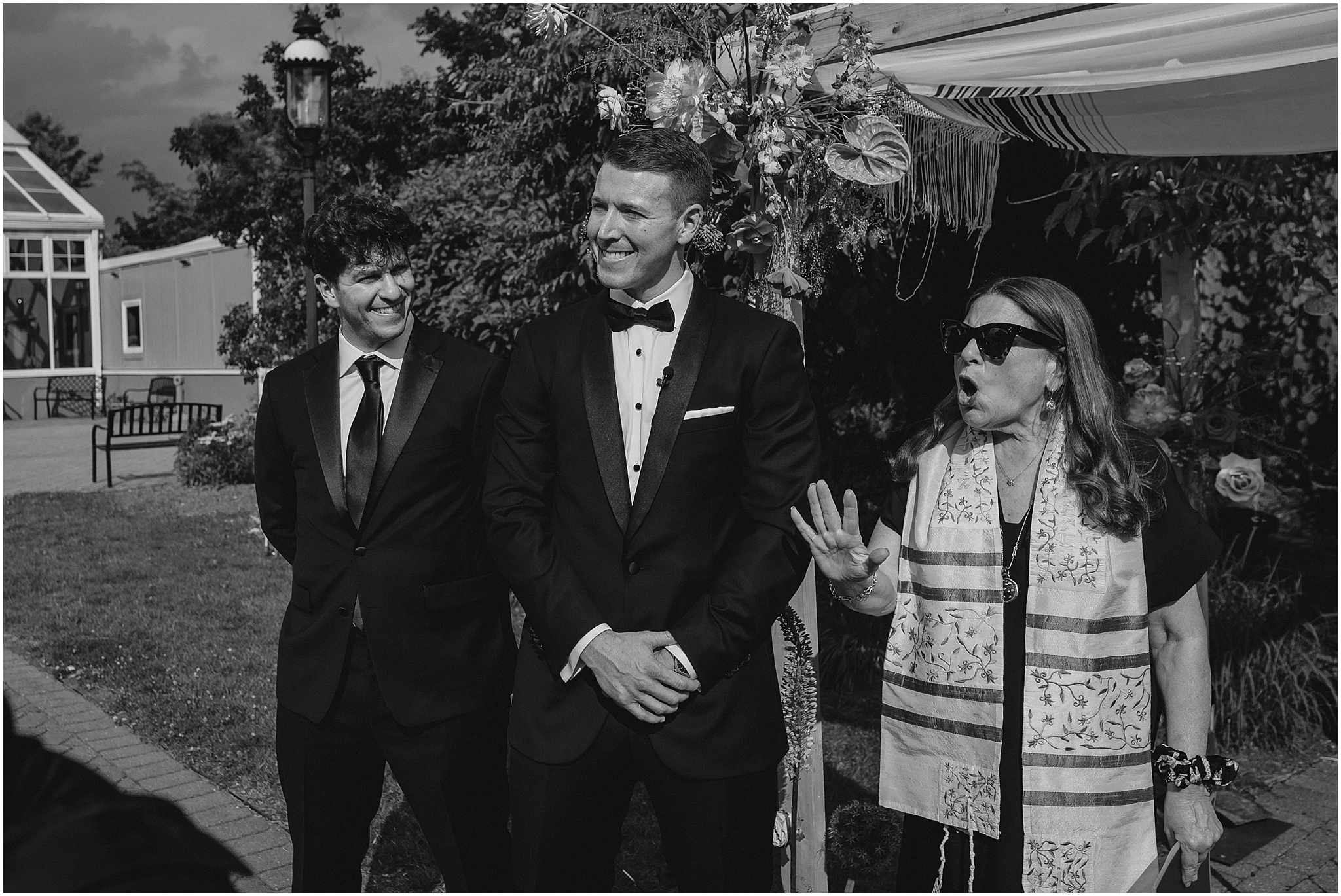 rabbi talks with groom before wedding ceremony outside the Conservatory at Sussex County Fairgrounds