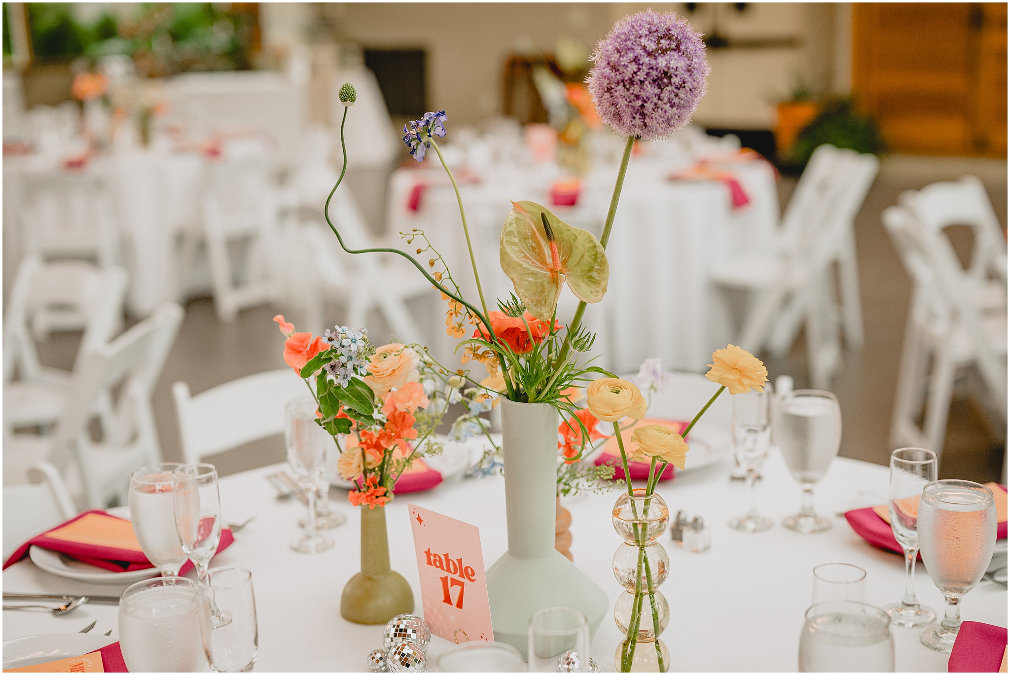 wildflower centerpieces on table at reception at the Conservatory at Sussex County Fairgrounds
