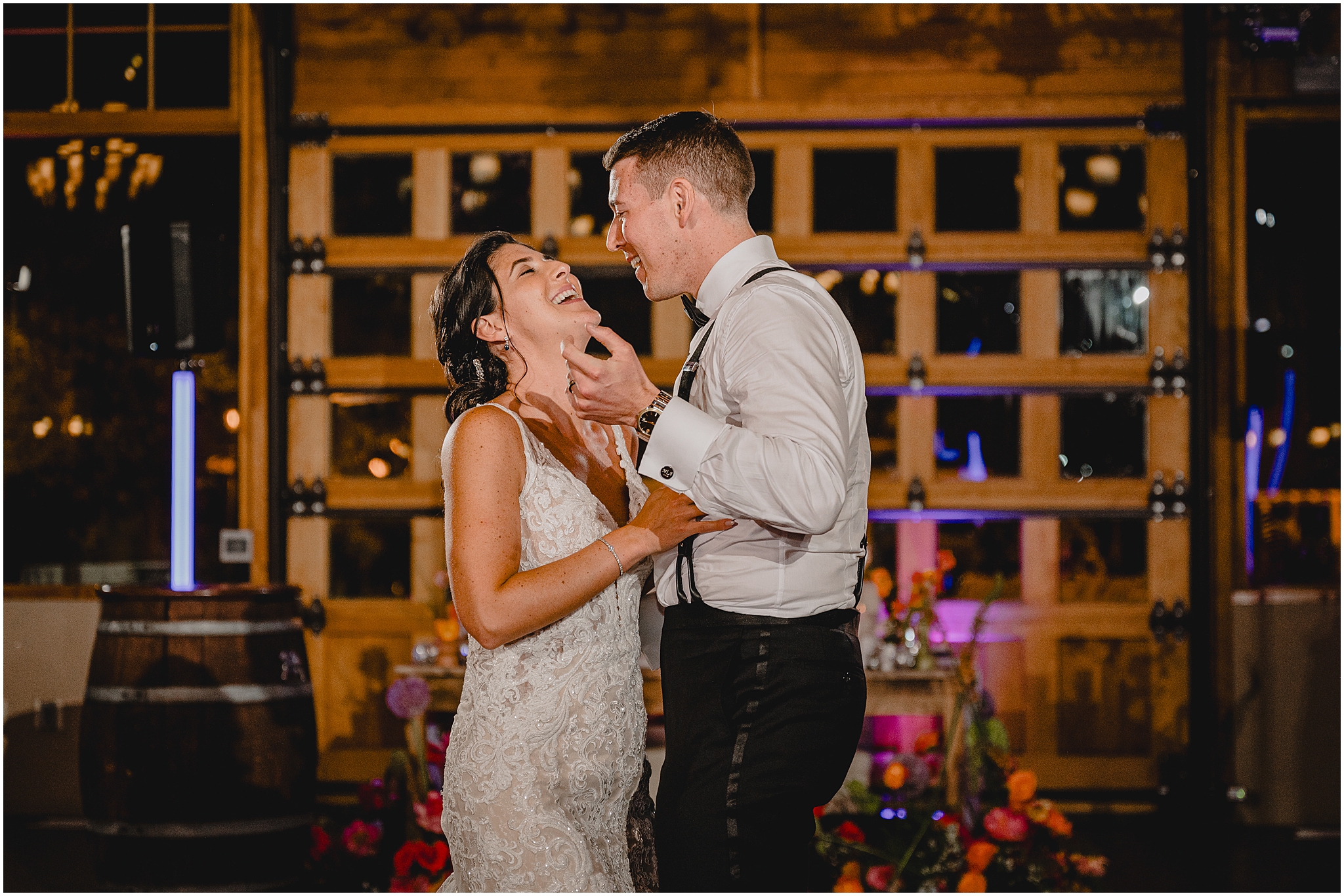 newlyweds laugh during first dance on floor at the Conservatory