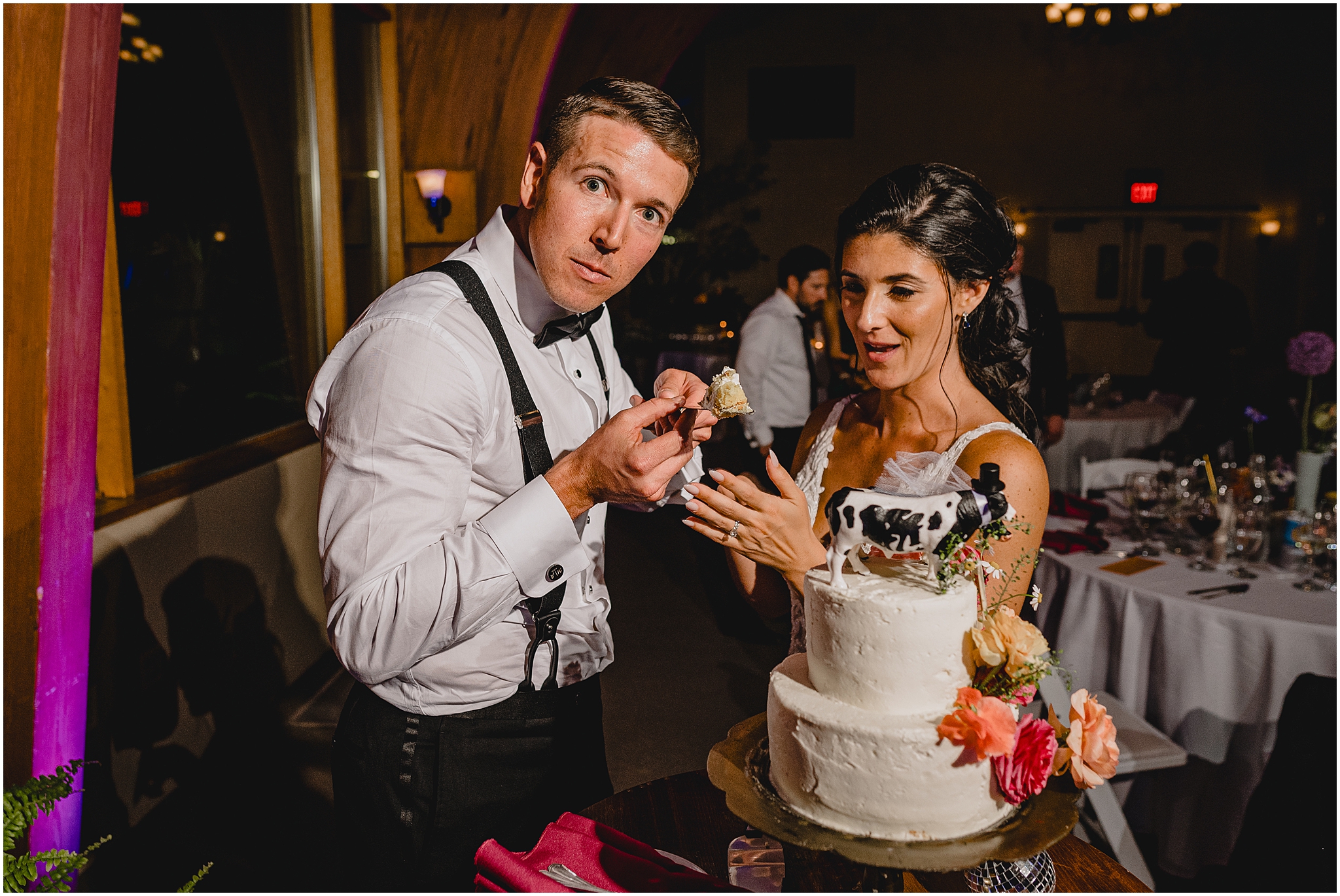 bride and groom cut wedding cake during NJ wedding reception