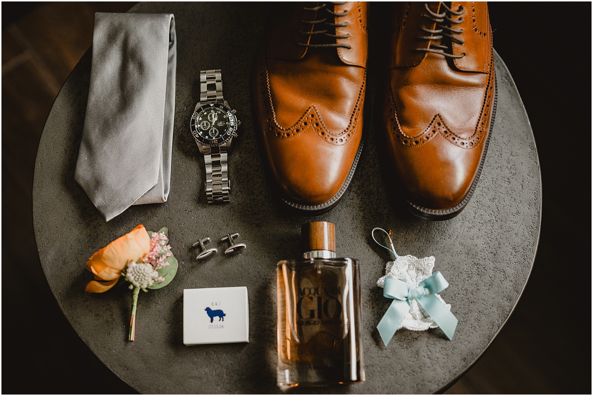 groom's brown shoes, cologne, and peach roses for summer wedding at the Perona Farms Refinery