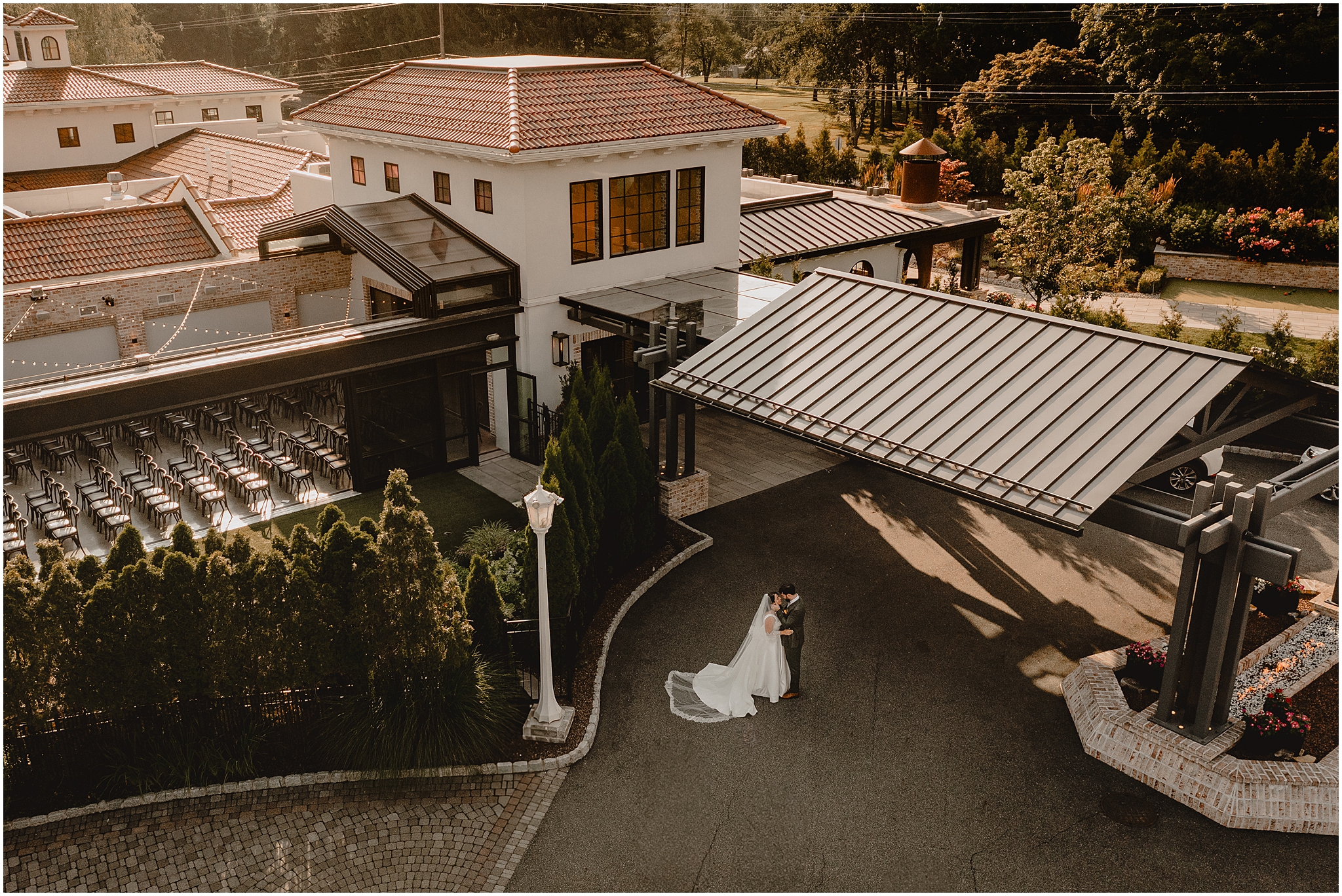 arial photo of newlyweds hugging in front of the Perona Farms Refinery