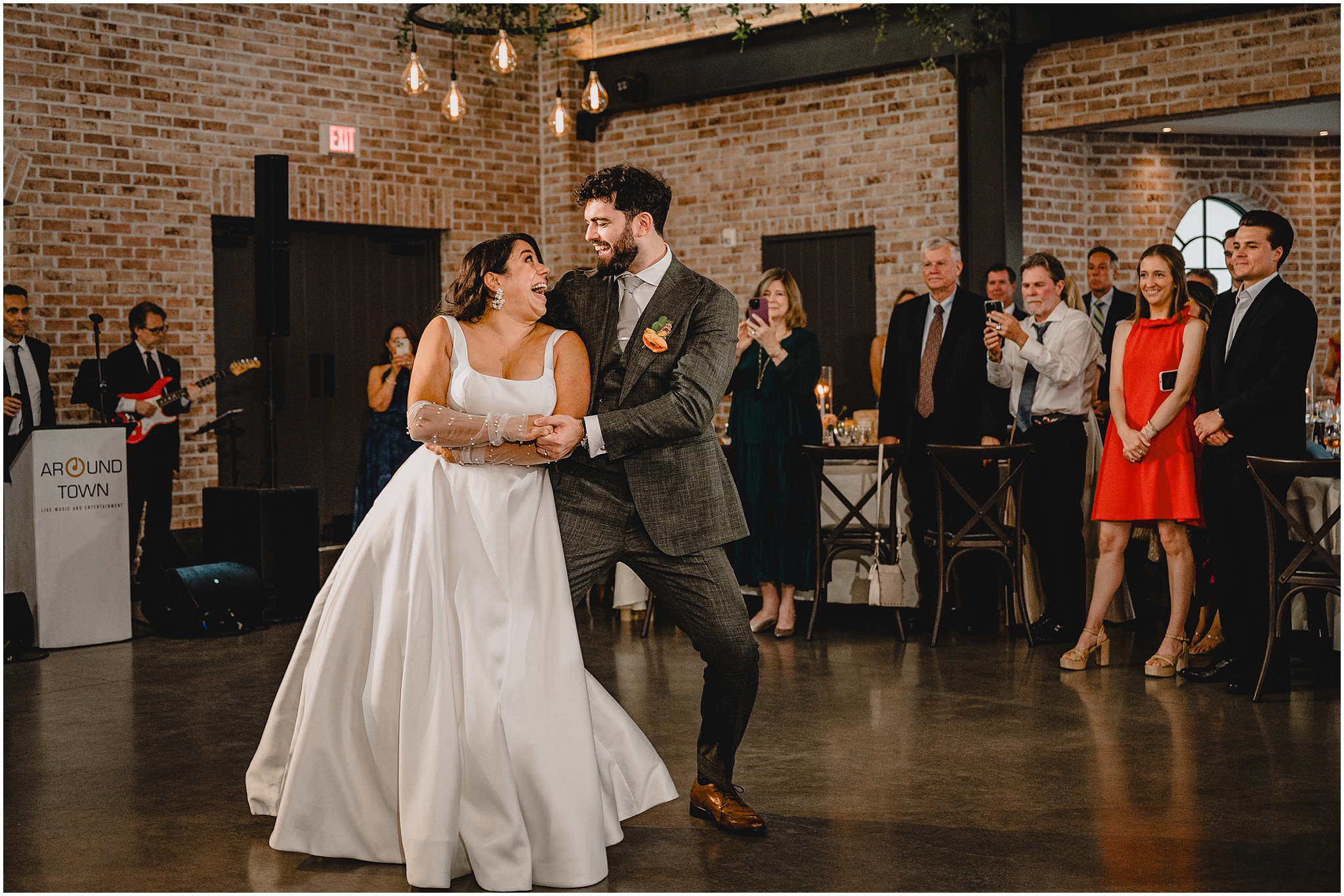 newlyweds dance together during summer wedding reception at the Perona Farms Refinery