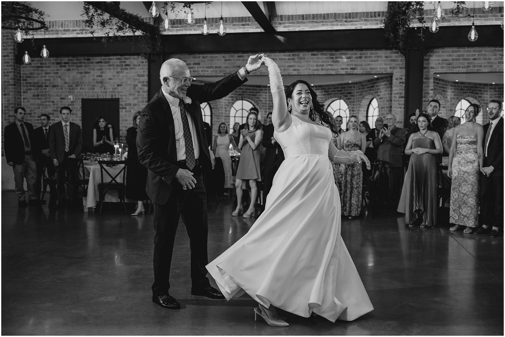 father twirls bride during NJ wedding reception 