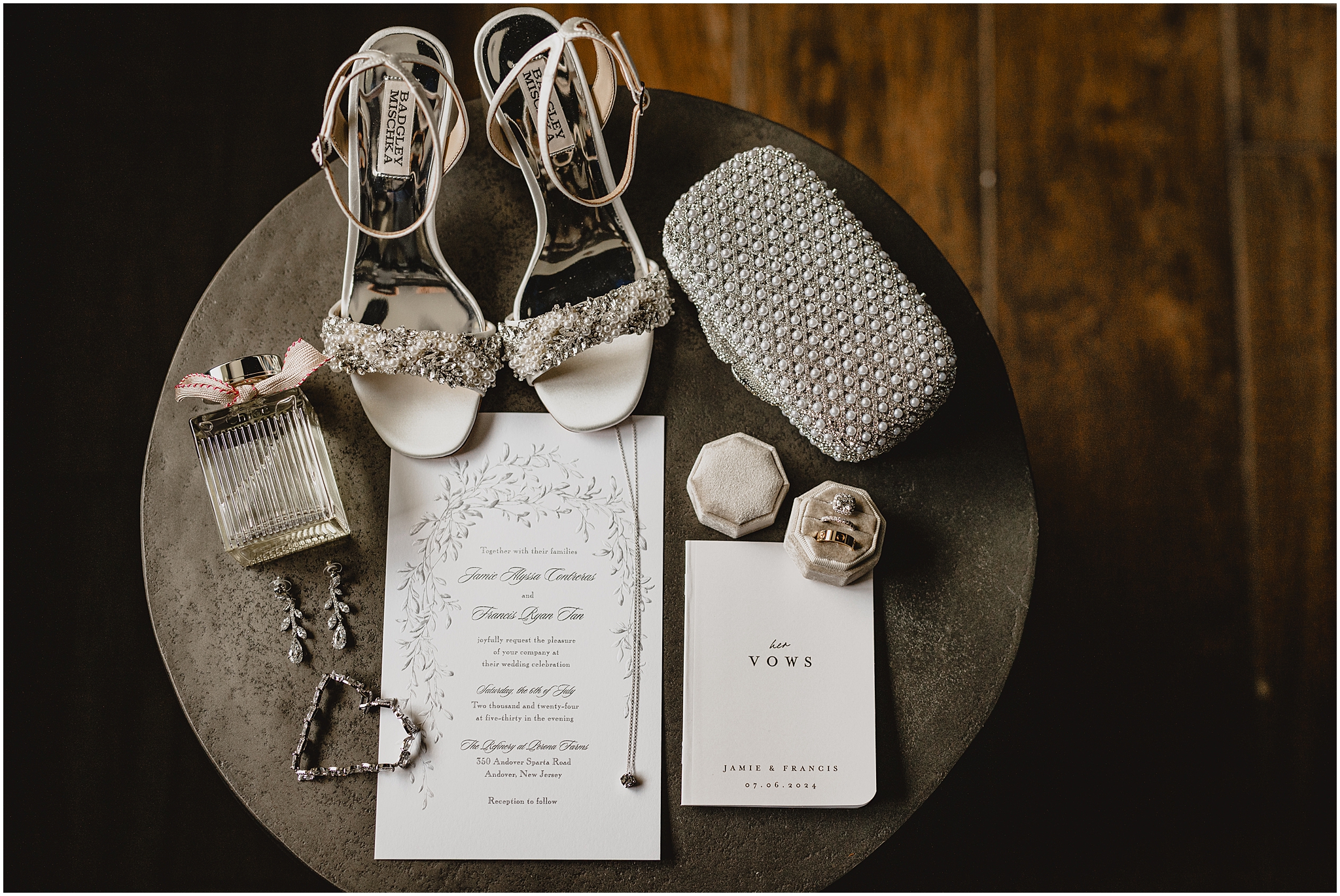 bride's shoes, black and white invitation suite, clutch and perfume for summer wedding day at the Refinery at Perona Farms