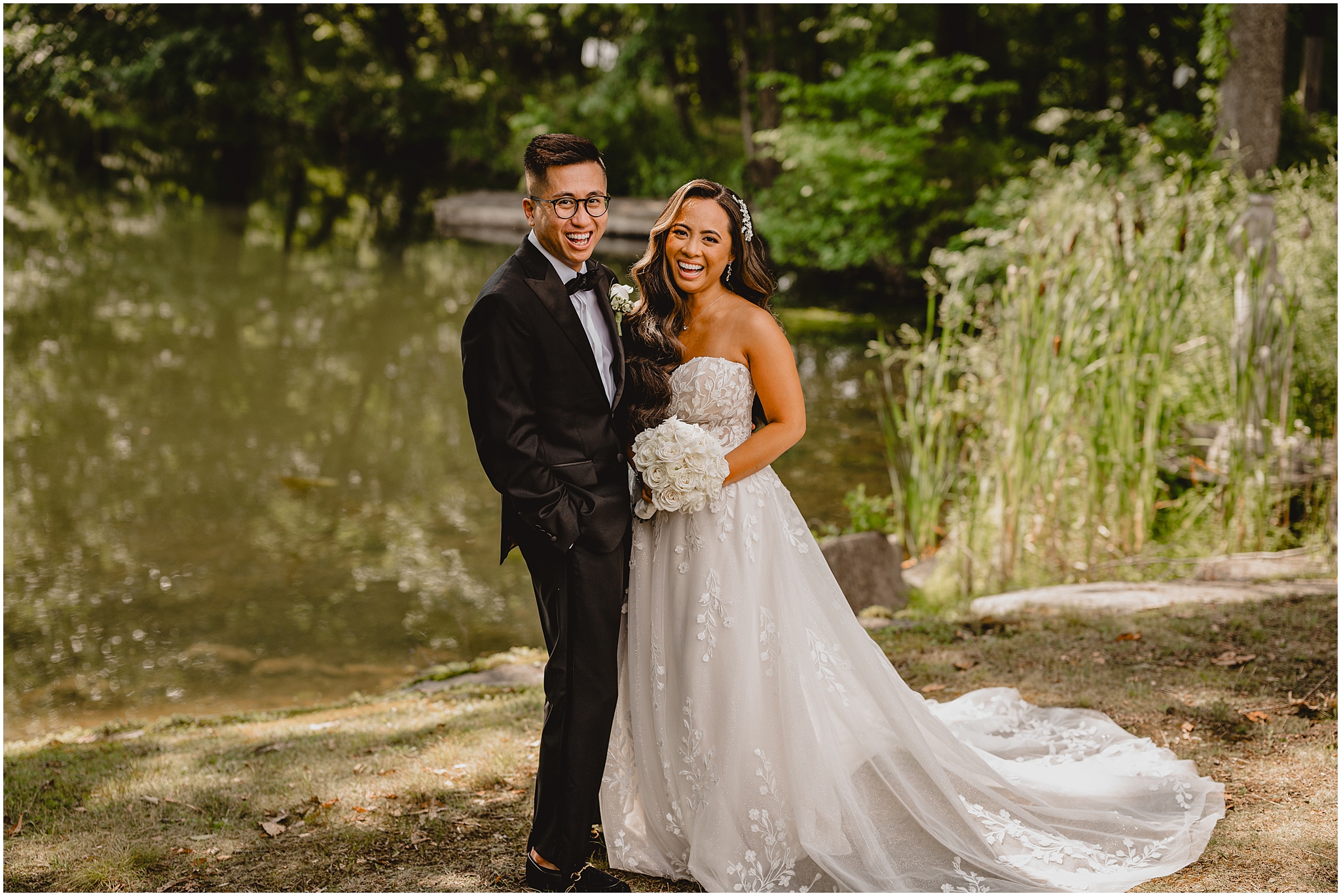 bride and groom laugh hugging by pond at the Refinery at Perona Farms