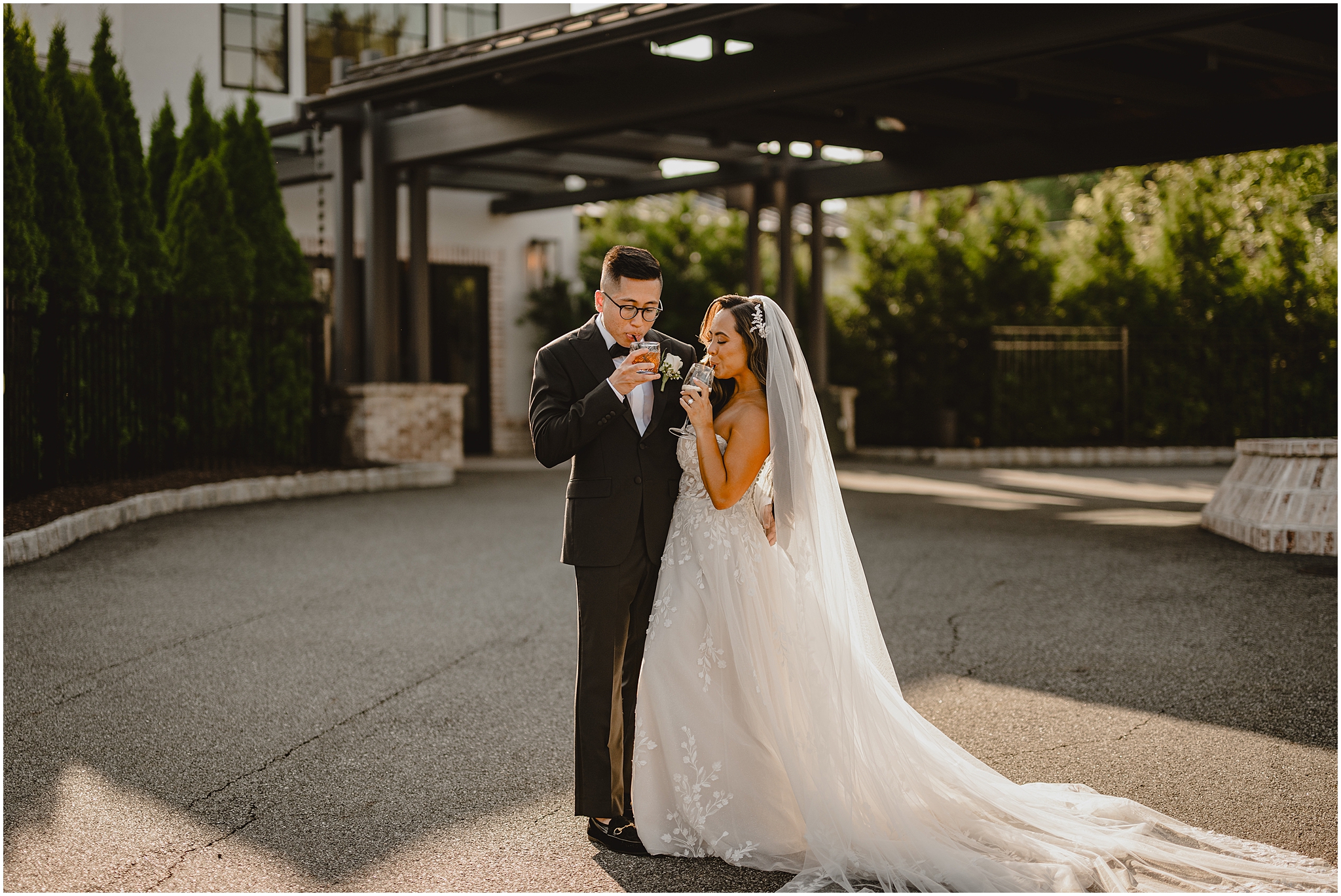 newlyweds drink champagne together during wedding portraits in New Jersey