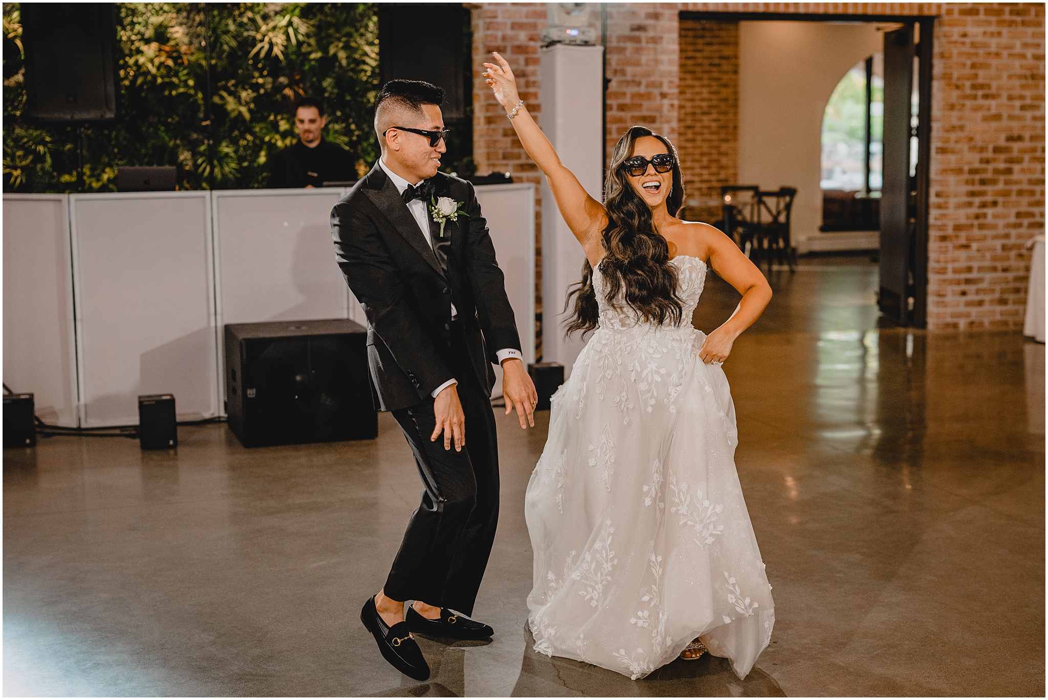 newlyweds dance wearing sunglasses walking into Andover NJ wedding reception