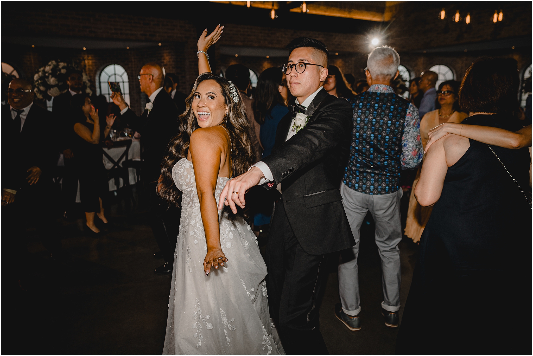 bride and groom dance with guests during Andover NJ wedding reception