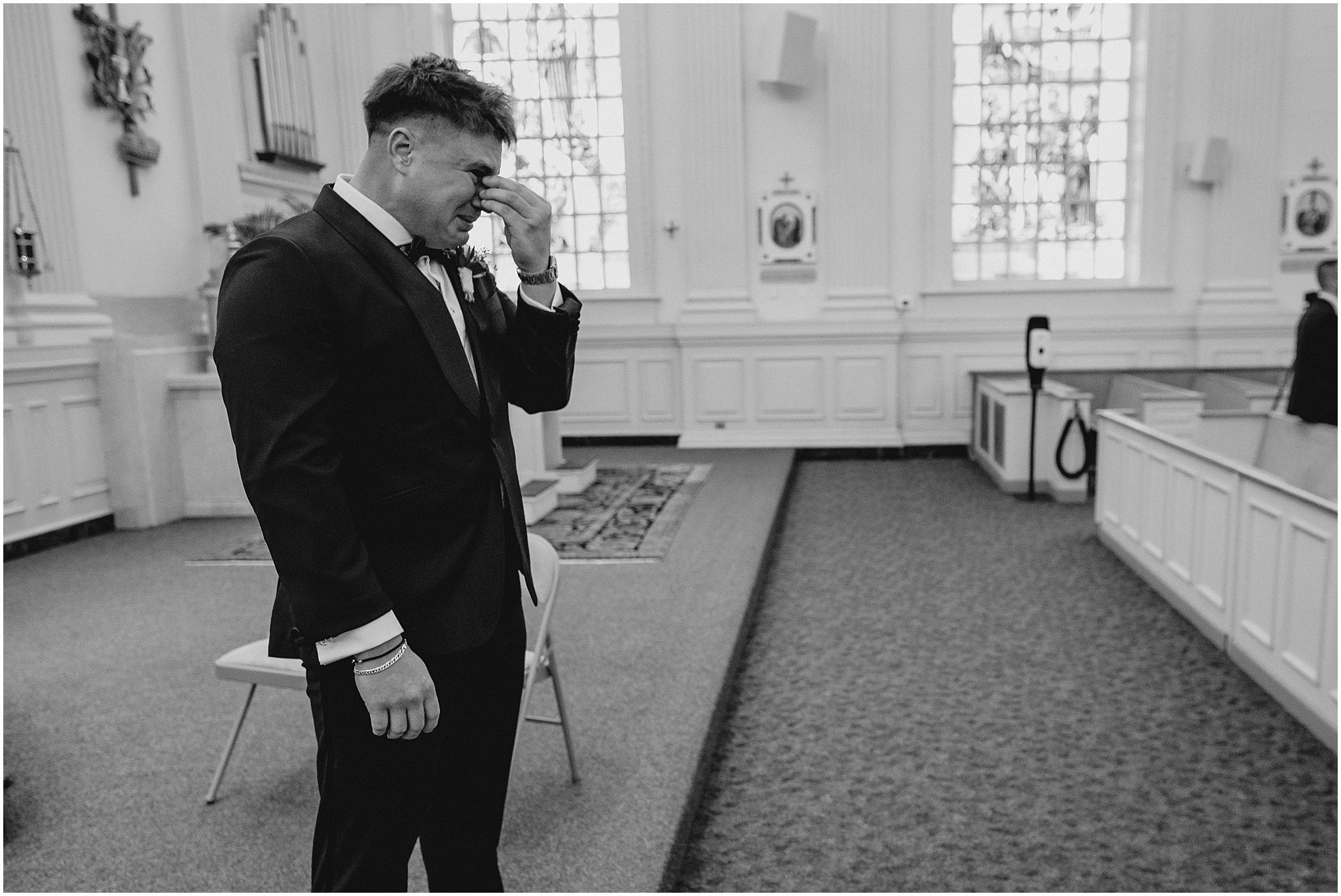 groom cries watching bride walk down aisle in church
