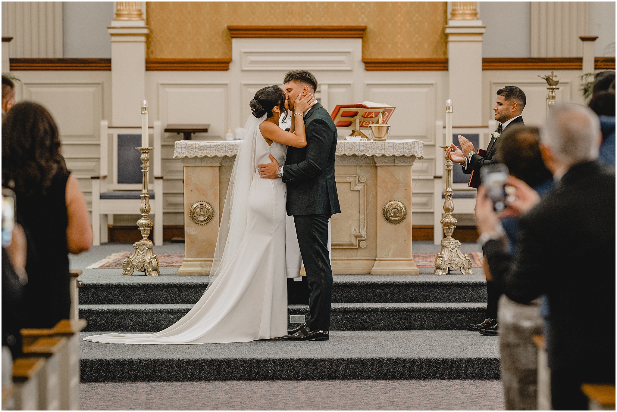 newlyweds kiss during wedding ceremony in Jersey City church