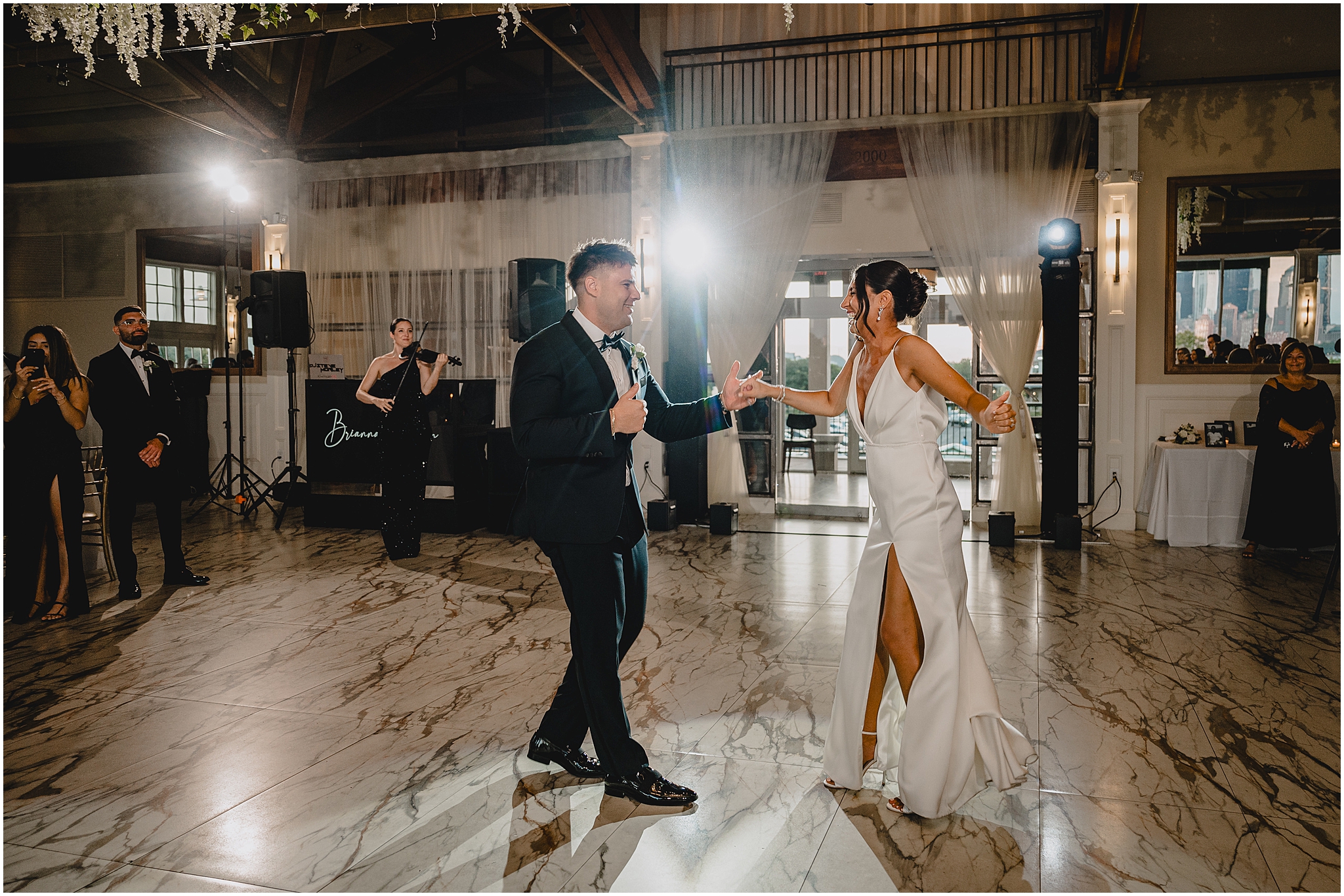 bride and groom dance on marbled floor during Liberty House wedding reception
