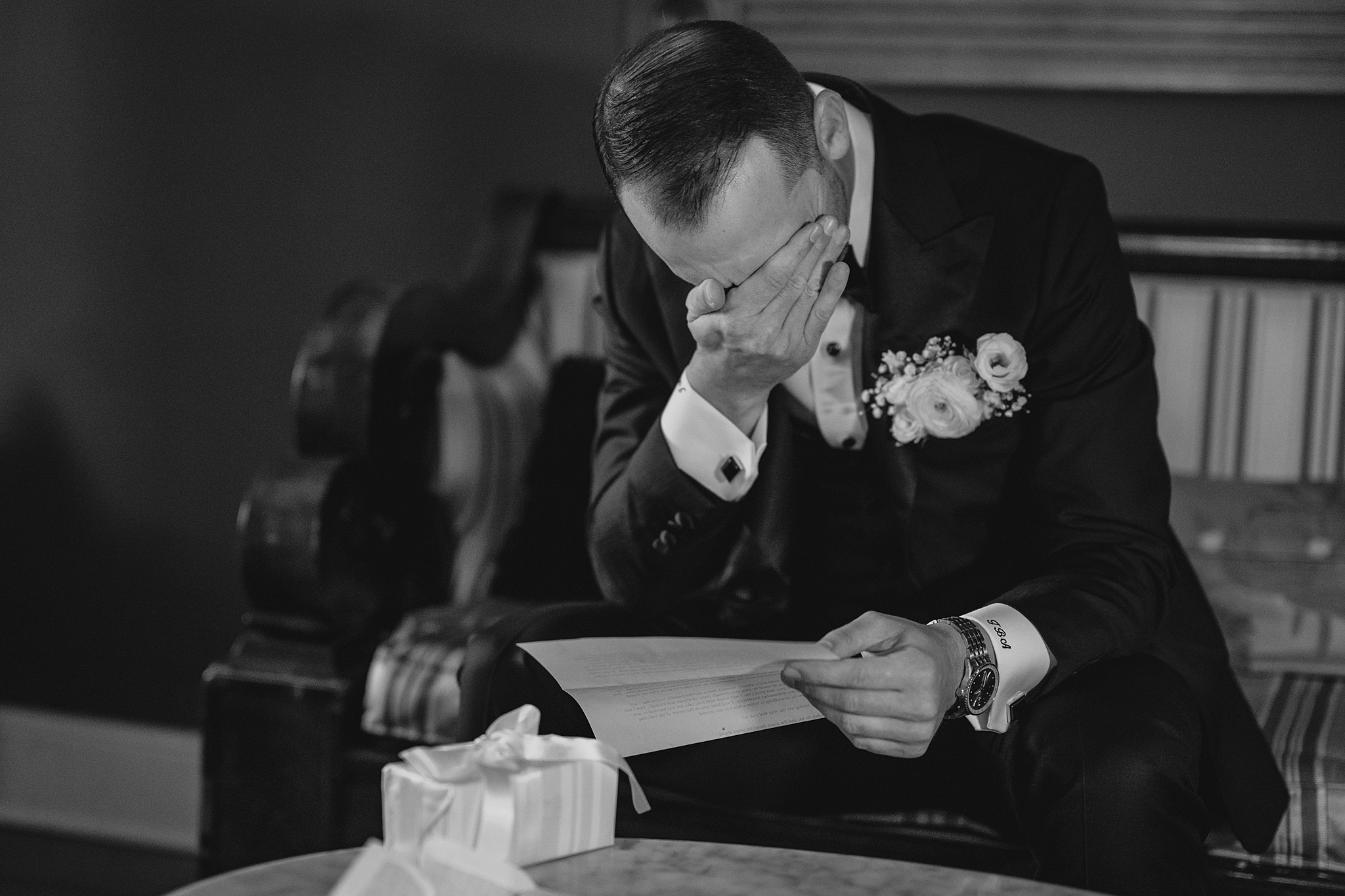 groom cries reading letter from bride on wedding day