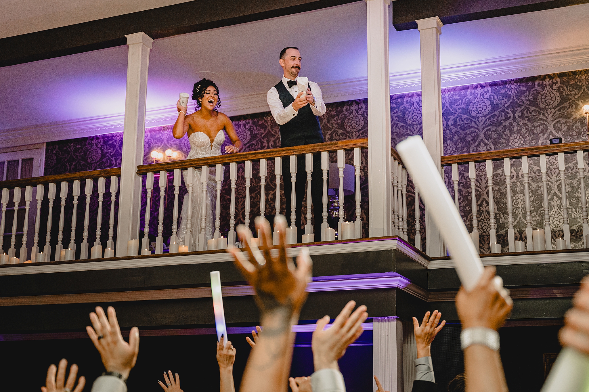 newlyweds toss t-shirts from balcony inside David's Country Inn