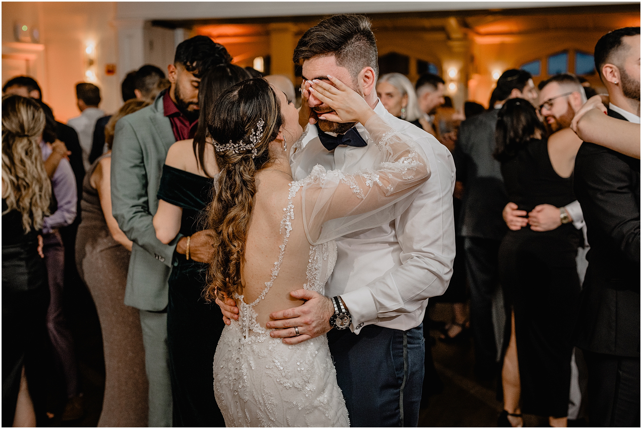 bride covers groom's eyes during dance at Whitby Castle