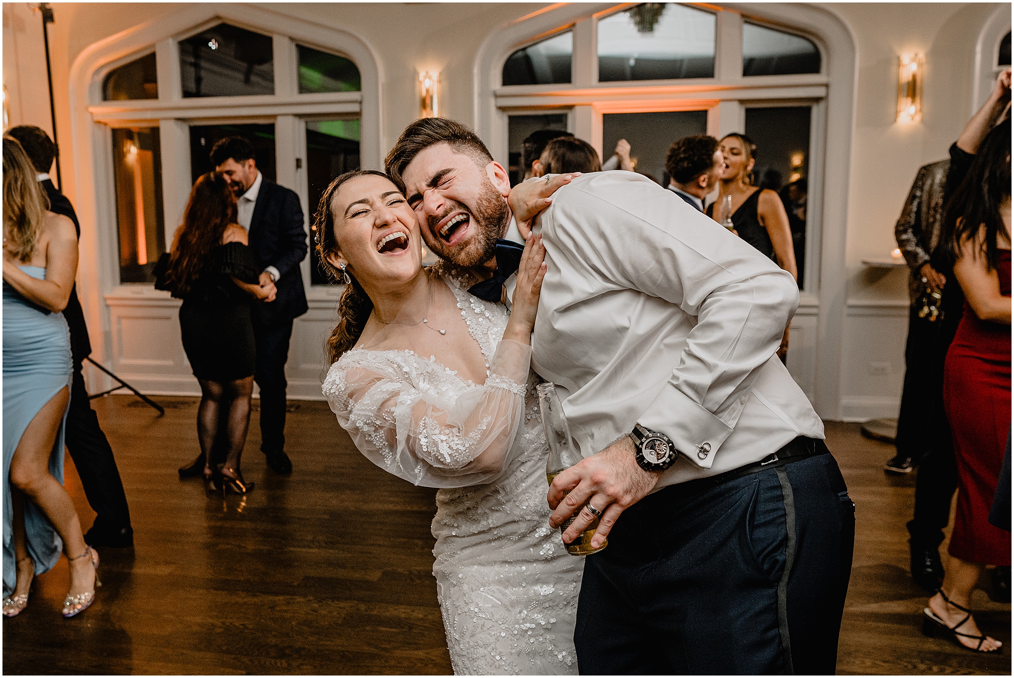 bride and groom sing together standing on dance floor at Whitby Castle