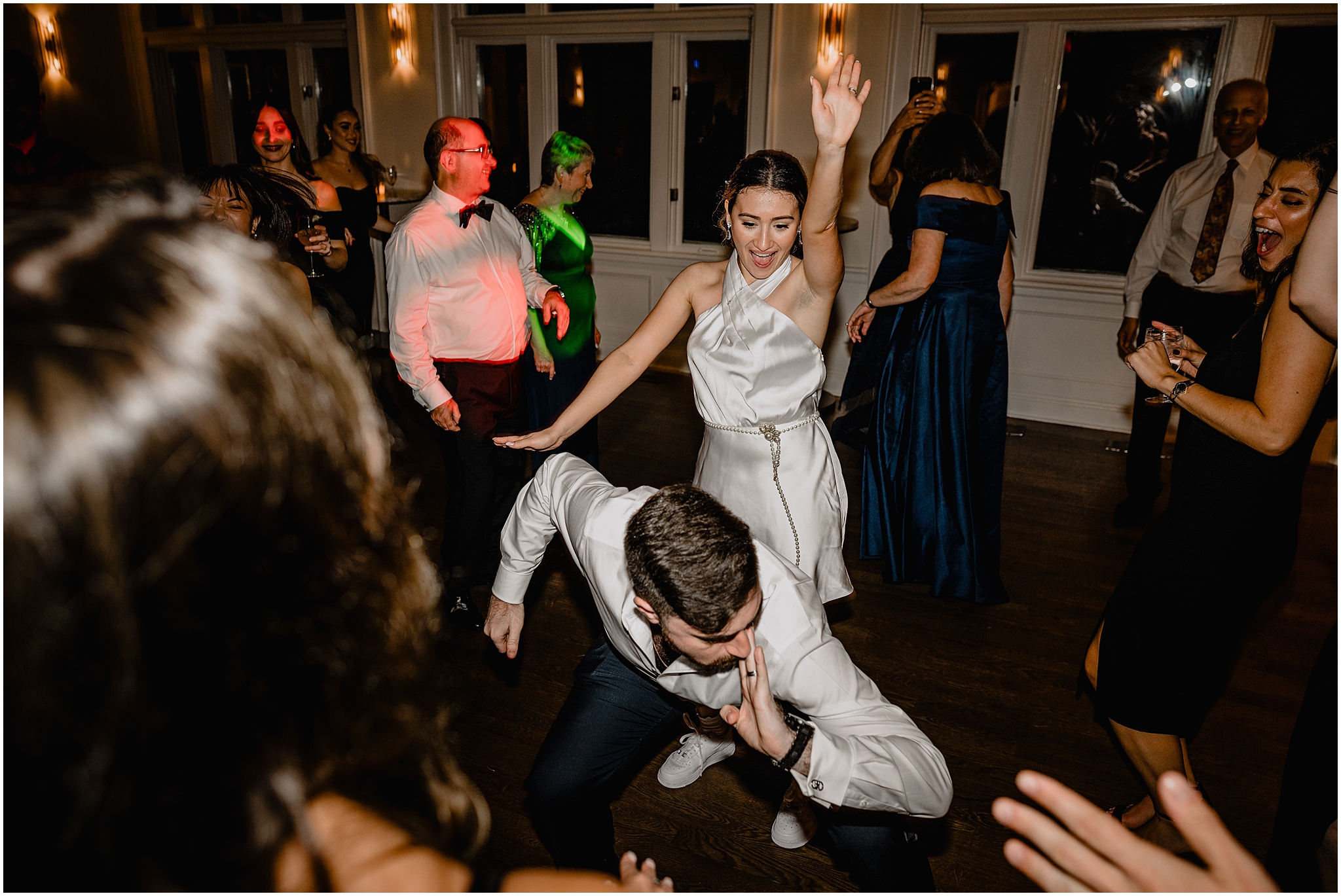 bride and groom dance together at NYC wedding reception at Whitby Castle