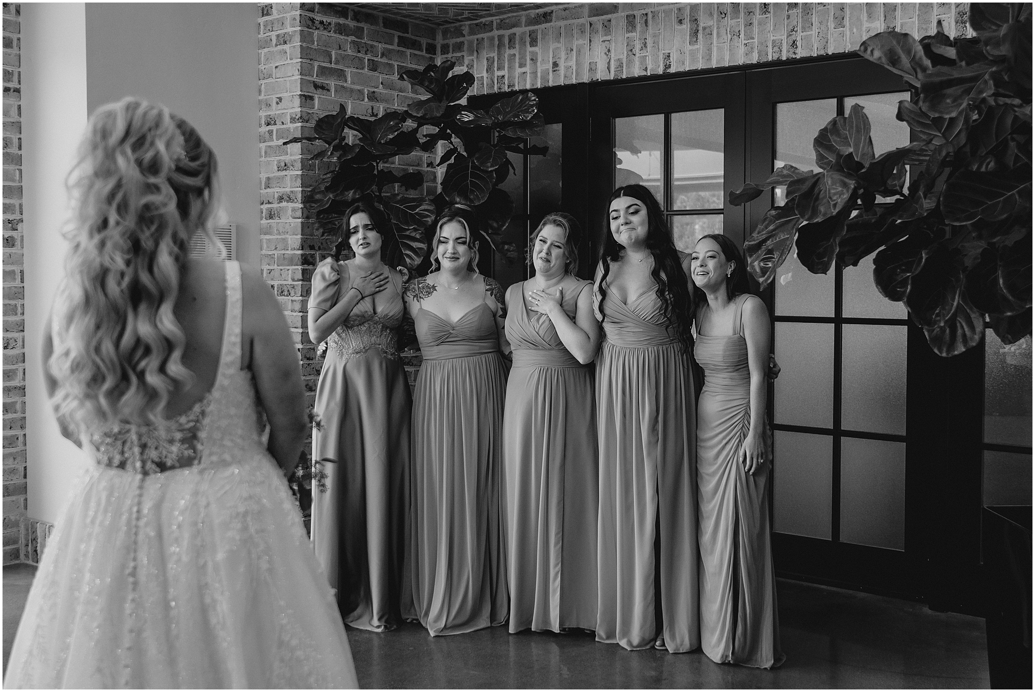 bridesmaids react to seeing bride in wedding dress 
