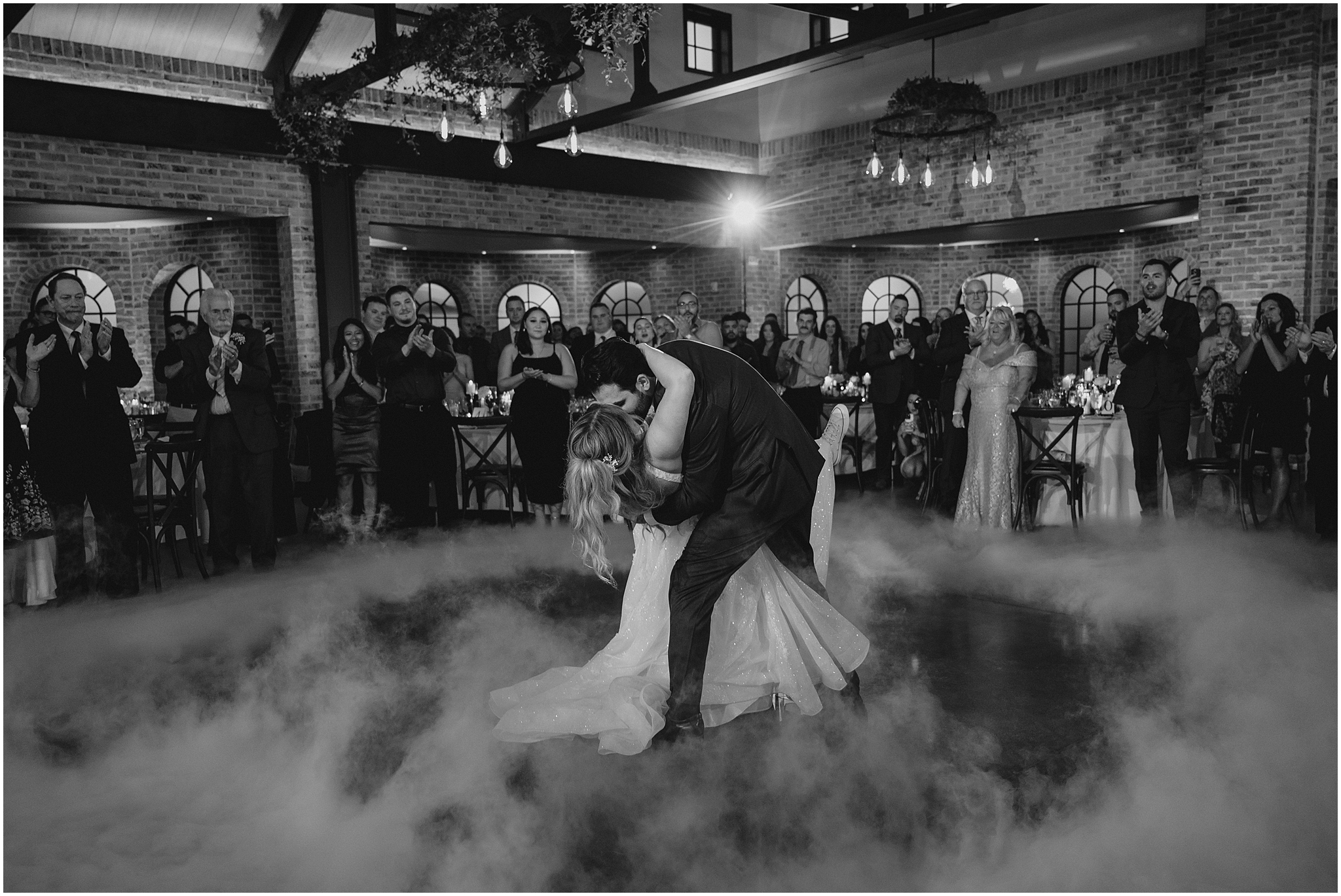 groom dips bride on dance floor as fog clears during New Jersey wedding reception 