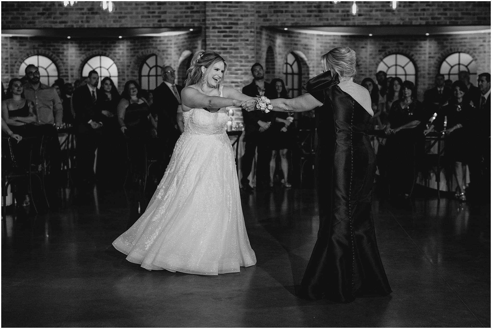 bride twirls around with mom on dance floor at Andover NJ wedding reception 