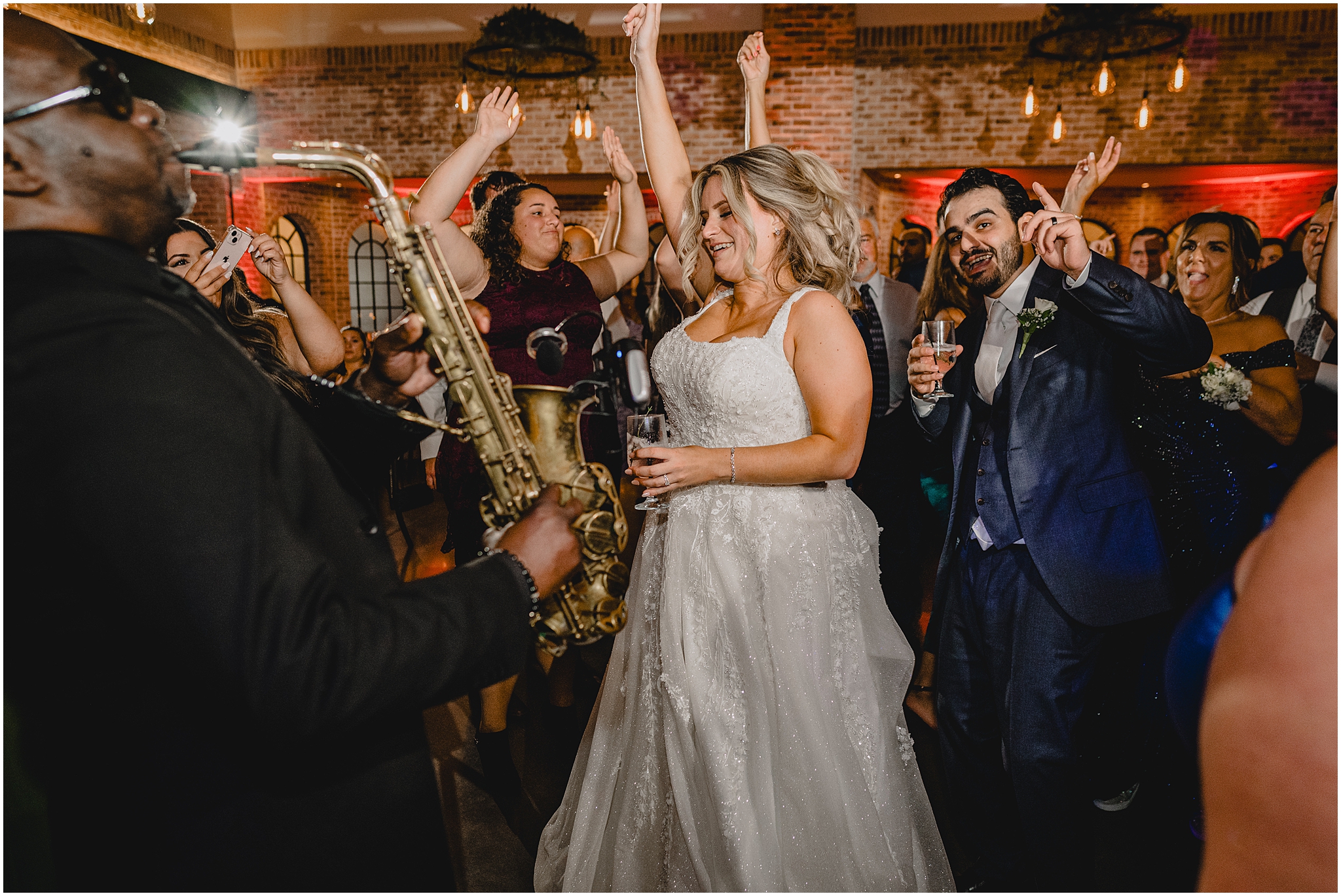 newlyweds dance with live band and saxophone player in Andover NJ