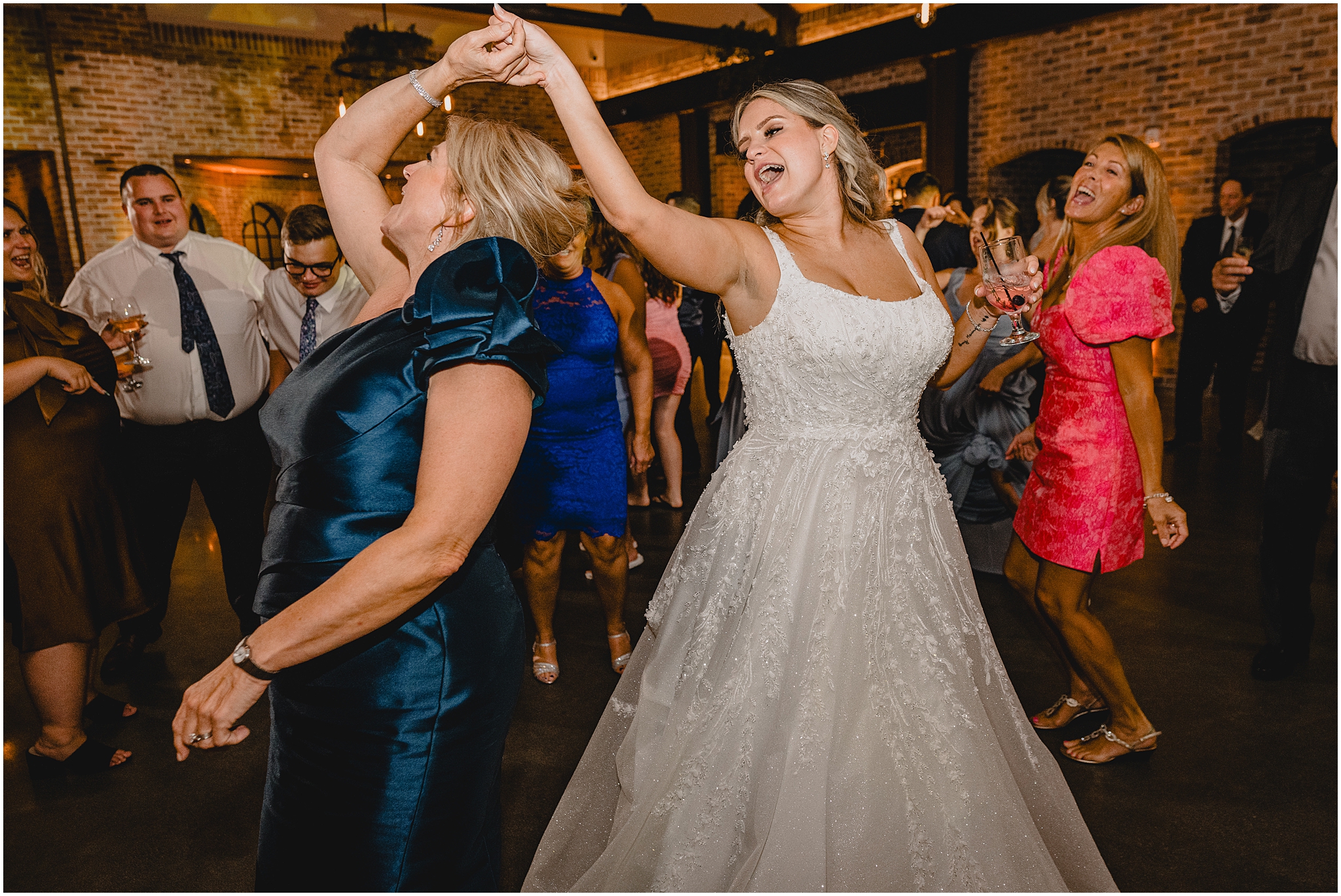 bride twirls mom on dance floor during Andover NJ wedding reception 