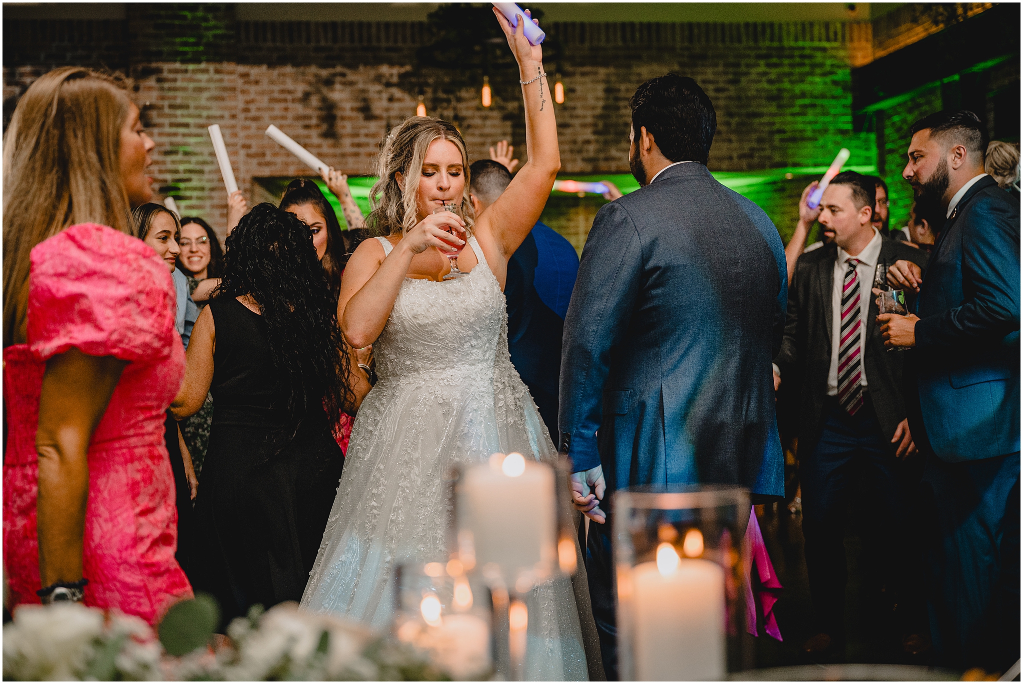 newlyweds dance together with glow sticks during reception in Andover NJ