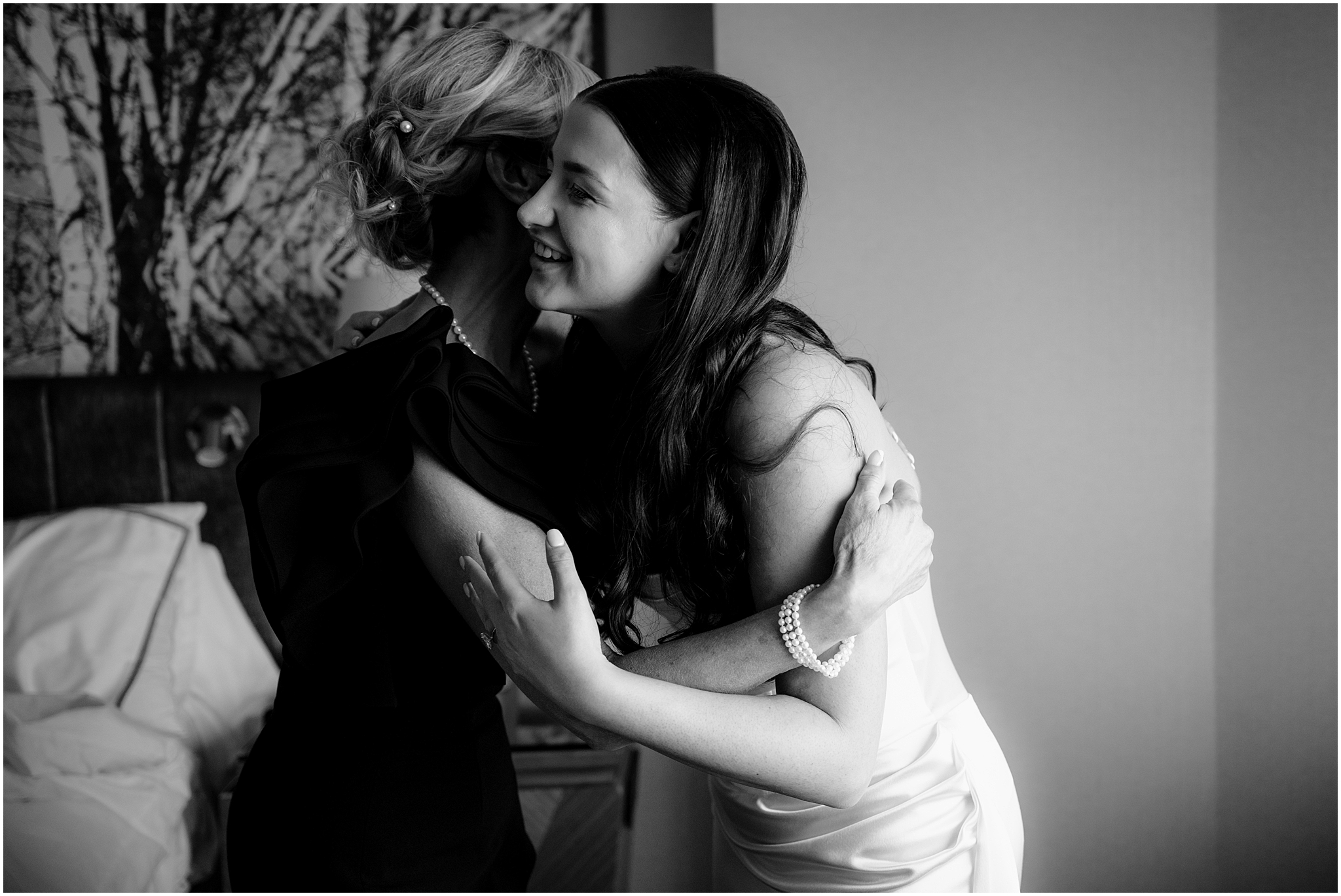 mother hugs bride during prep in NJ hotel room