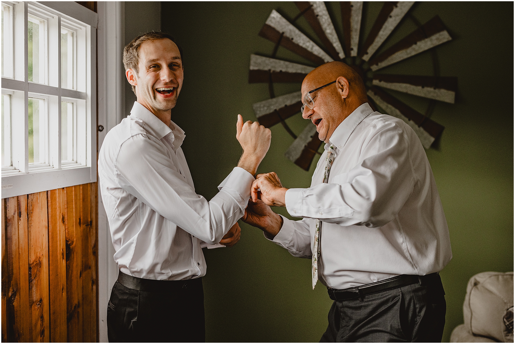 father helps groom with cufflinks on the morning of his wedding in groom's suite at the Reserve at Perona Farms
