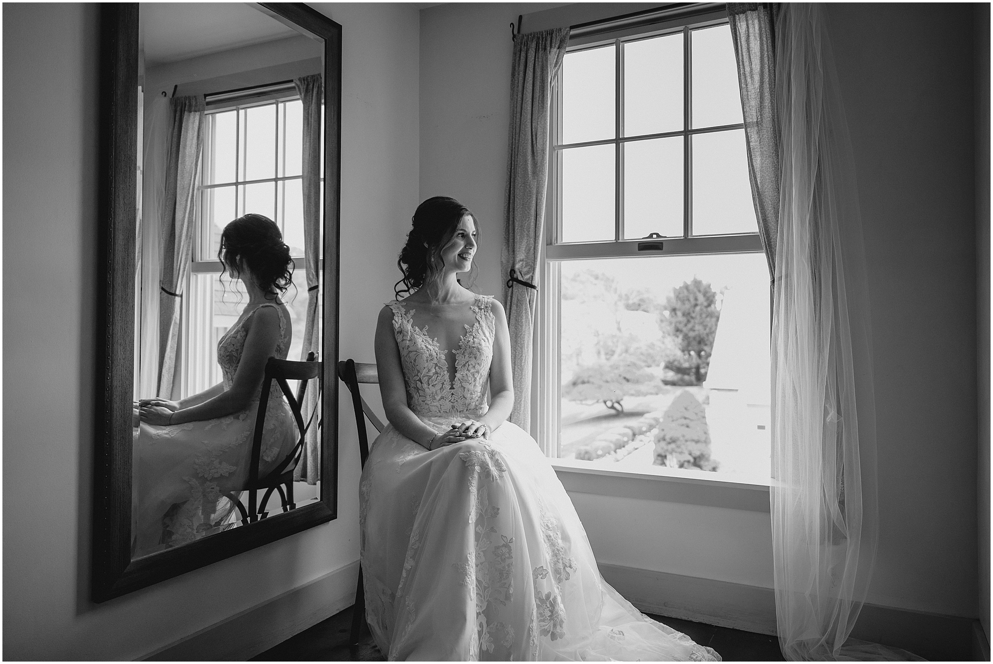 bride sits in corner of suite at the Reserve at Perona Farms