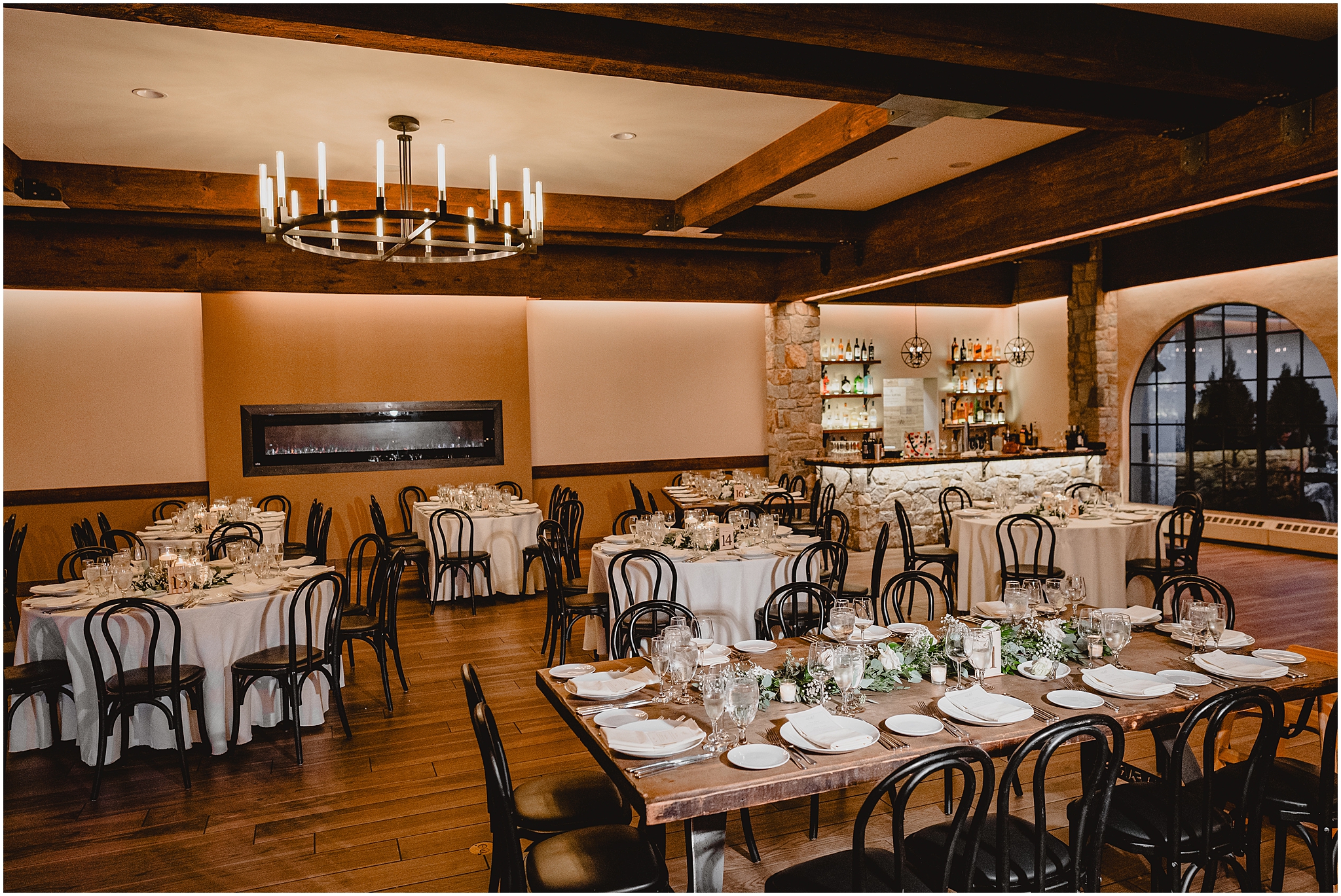 wedding reception in ballroom with exposed beams at Reserve at Perona Farms