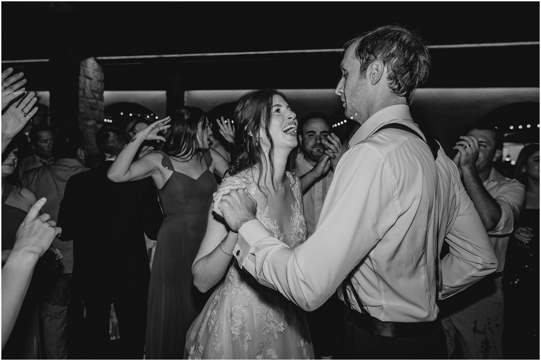bride and groom hold hands dancing during reception in Andover NJ