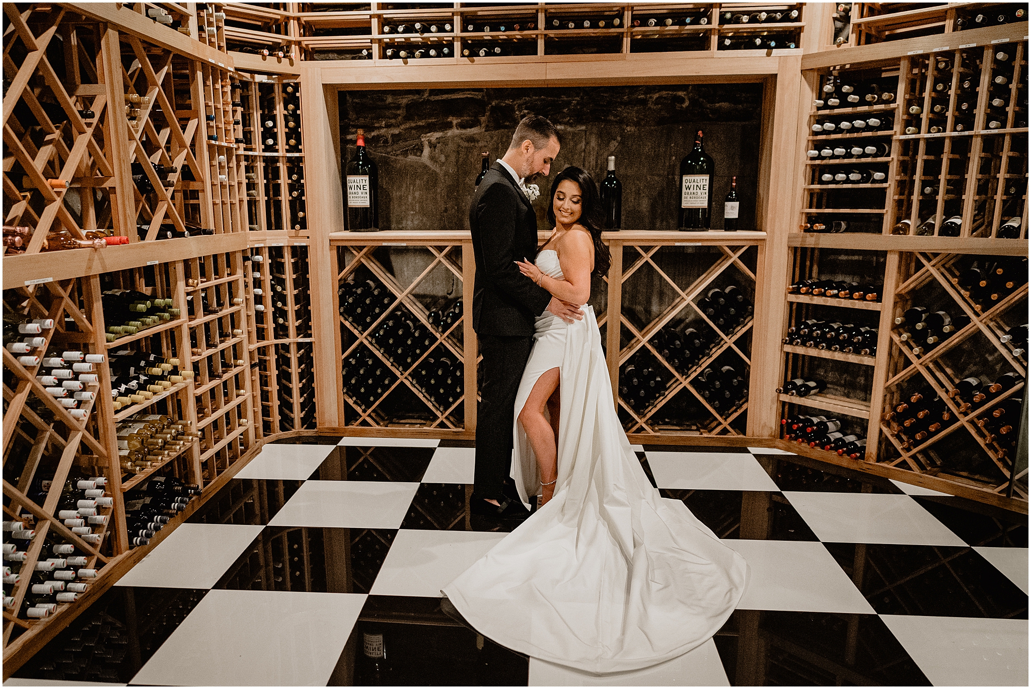 bride and groom hug in the wine cellar of The Logan Inn