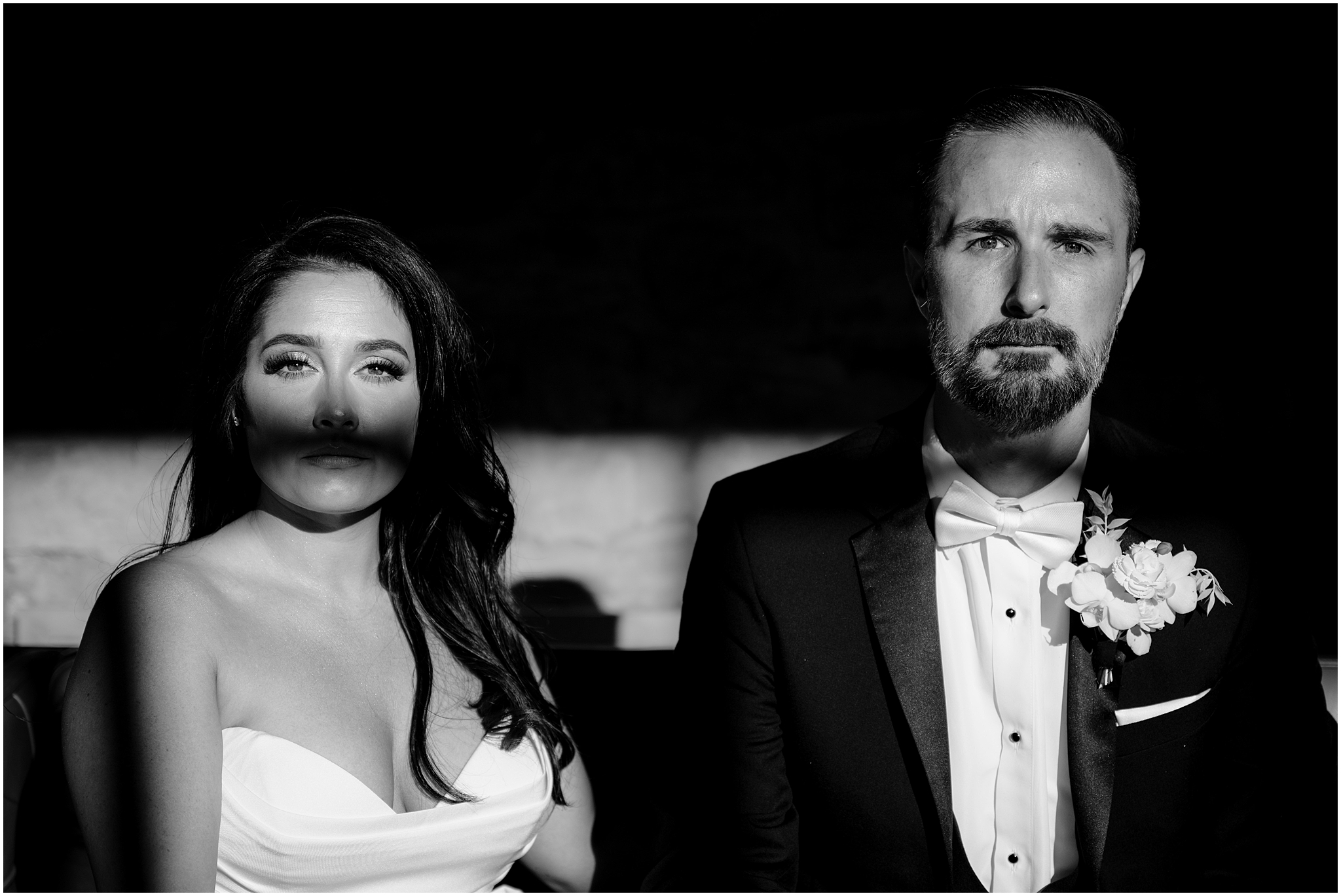 portrait of bride and room with shadows across their face and chest